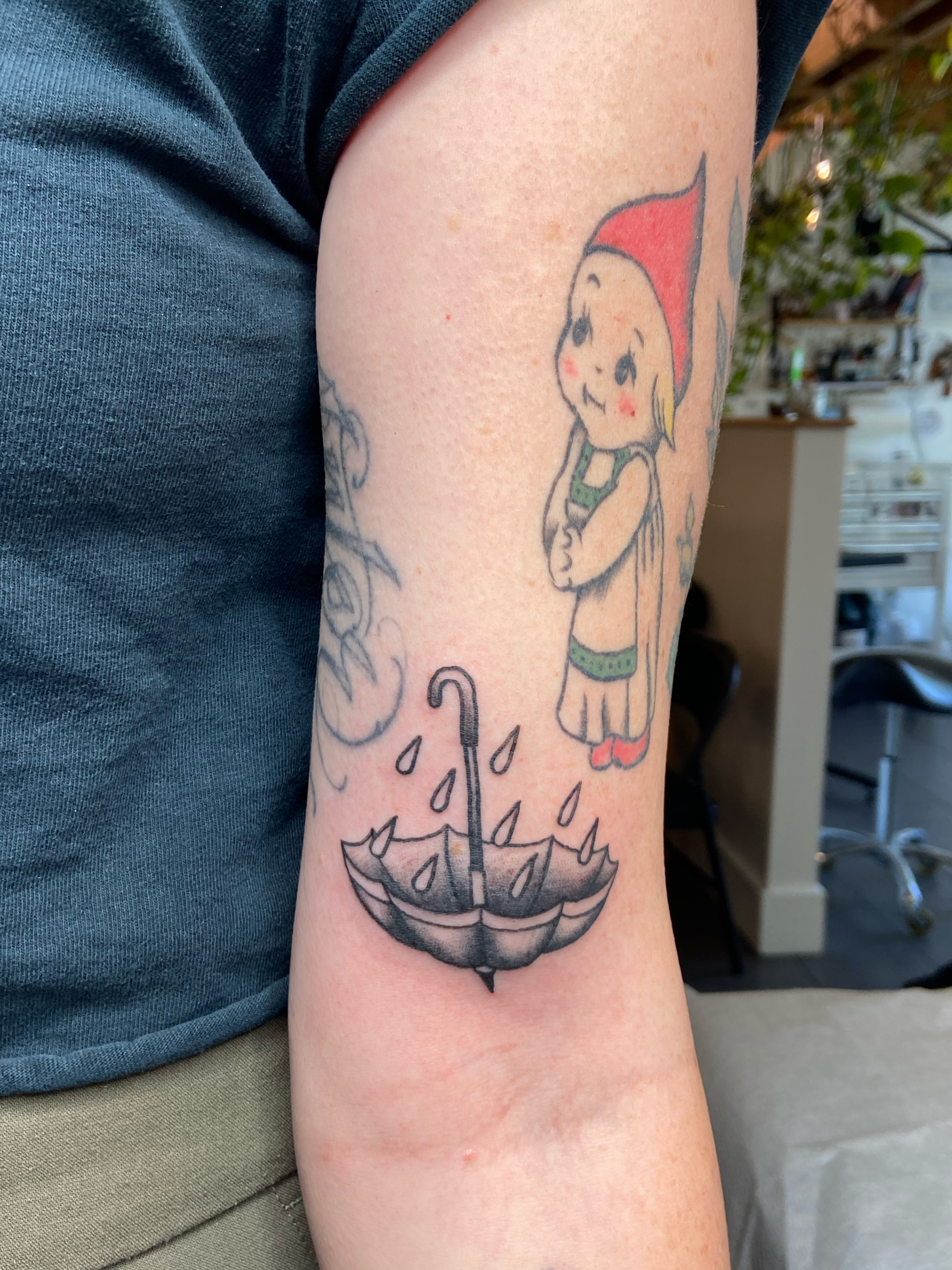 Little girl with umbrella American traditional tattoo on the forearm by Derek Krueger Portland Tattoo Artist, Portland, Oregon