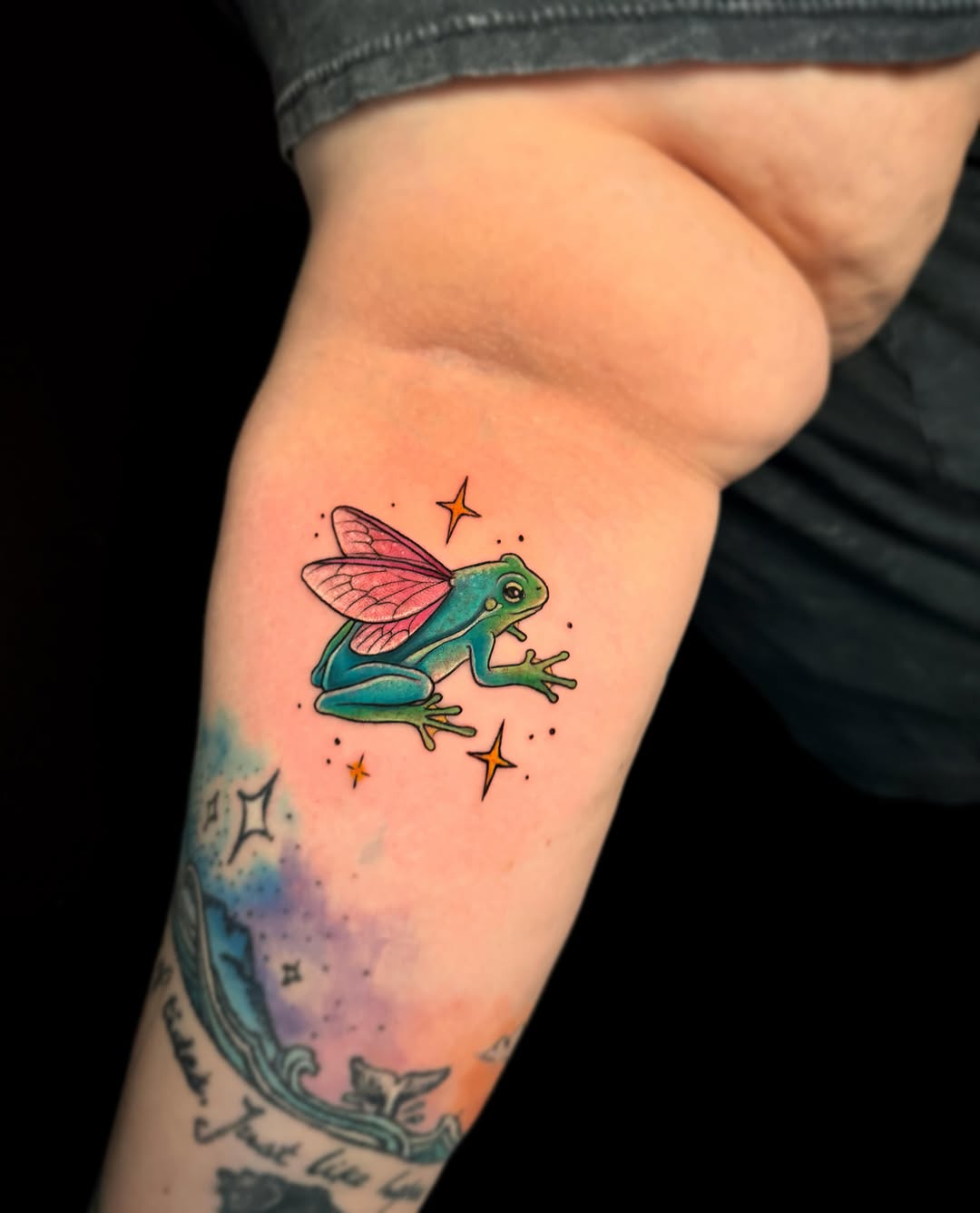 Frog with wings watercolor tattoo on the forearm by Violet Michelle Williams, Charlotte, North Carolina