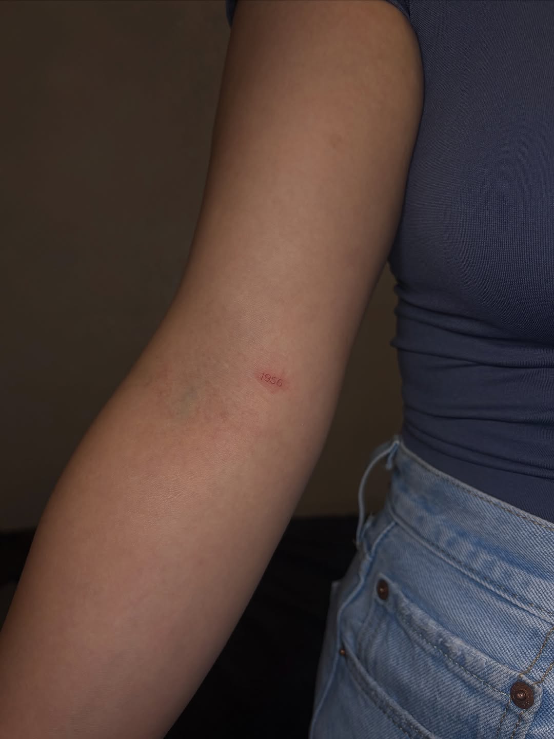 Year 1956 minimalist tattoo on the forearm by Valentina