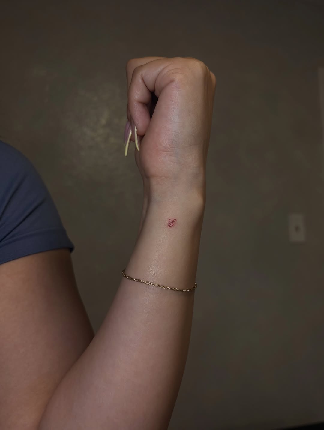 Letter E minimalist tattoo on the forearm by Valentina