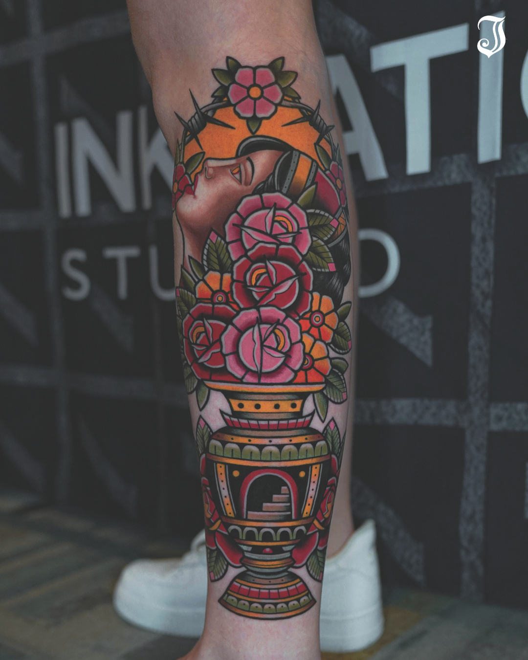 Flowers and vase American traditional tattoo on the calf by Ryan Moraski, Colorado Springs, Colorado