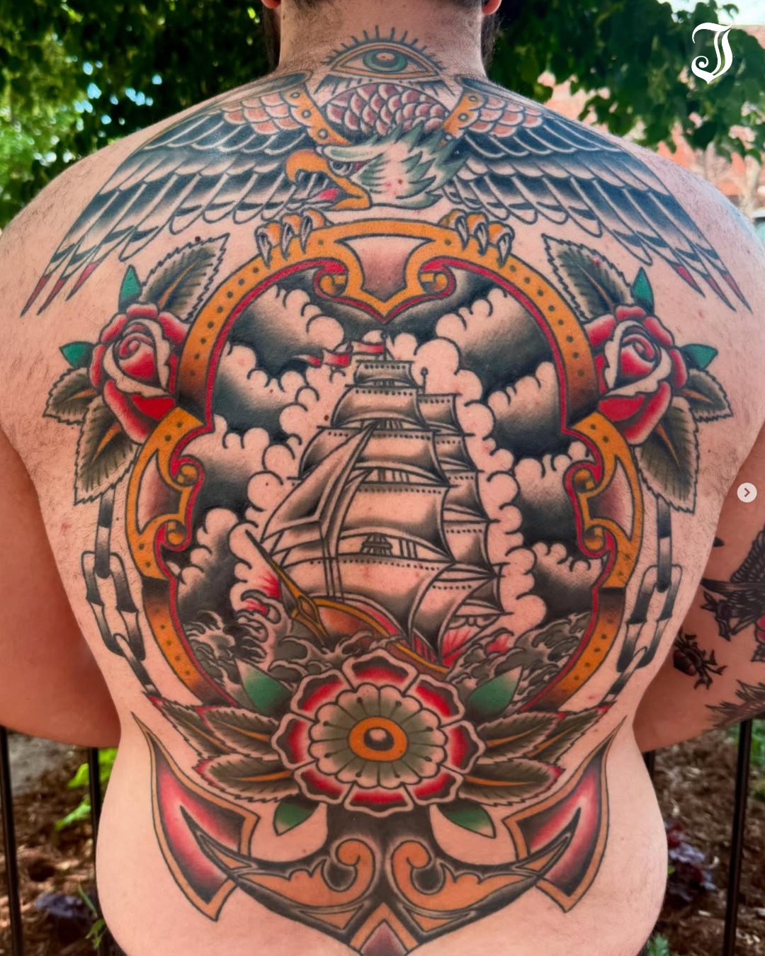 Ship and floral American traditional tattoo on the back by Ryan Moraski, Colorado Springs, Colorado