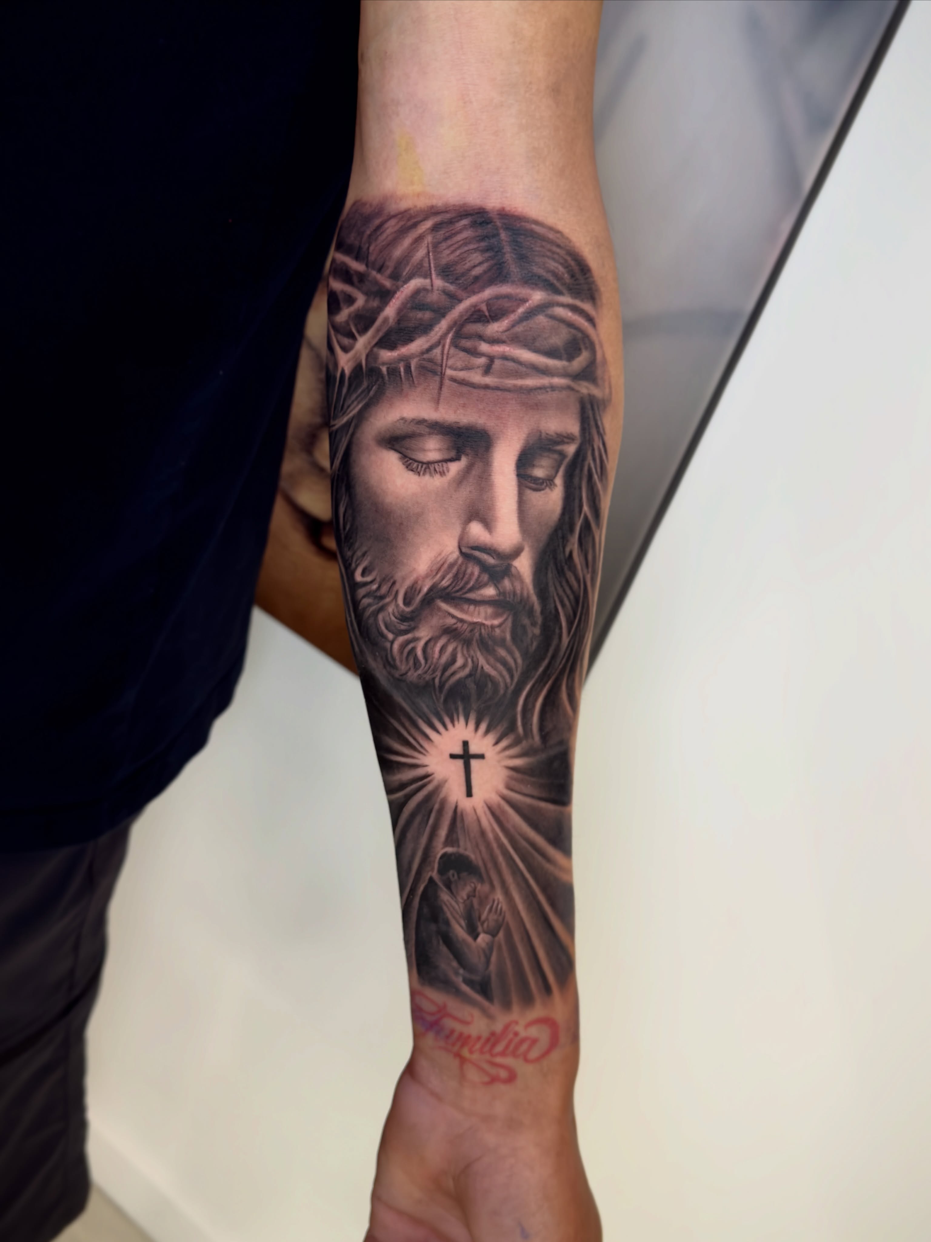 Religious figure realism tattoo on the forearm by Brandon Patino