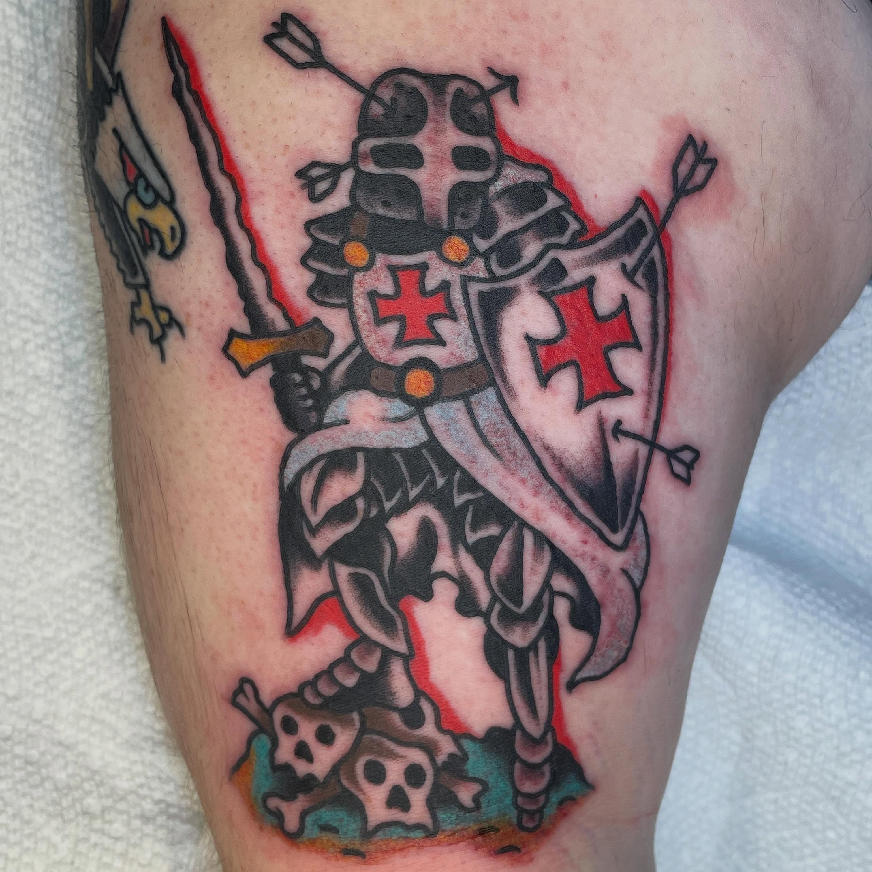 Knight with cross American traditional tattoo on the thigh by Nicholas M. Passeri