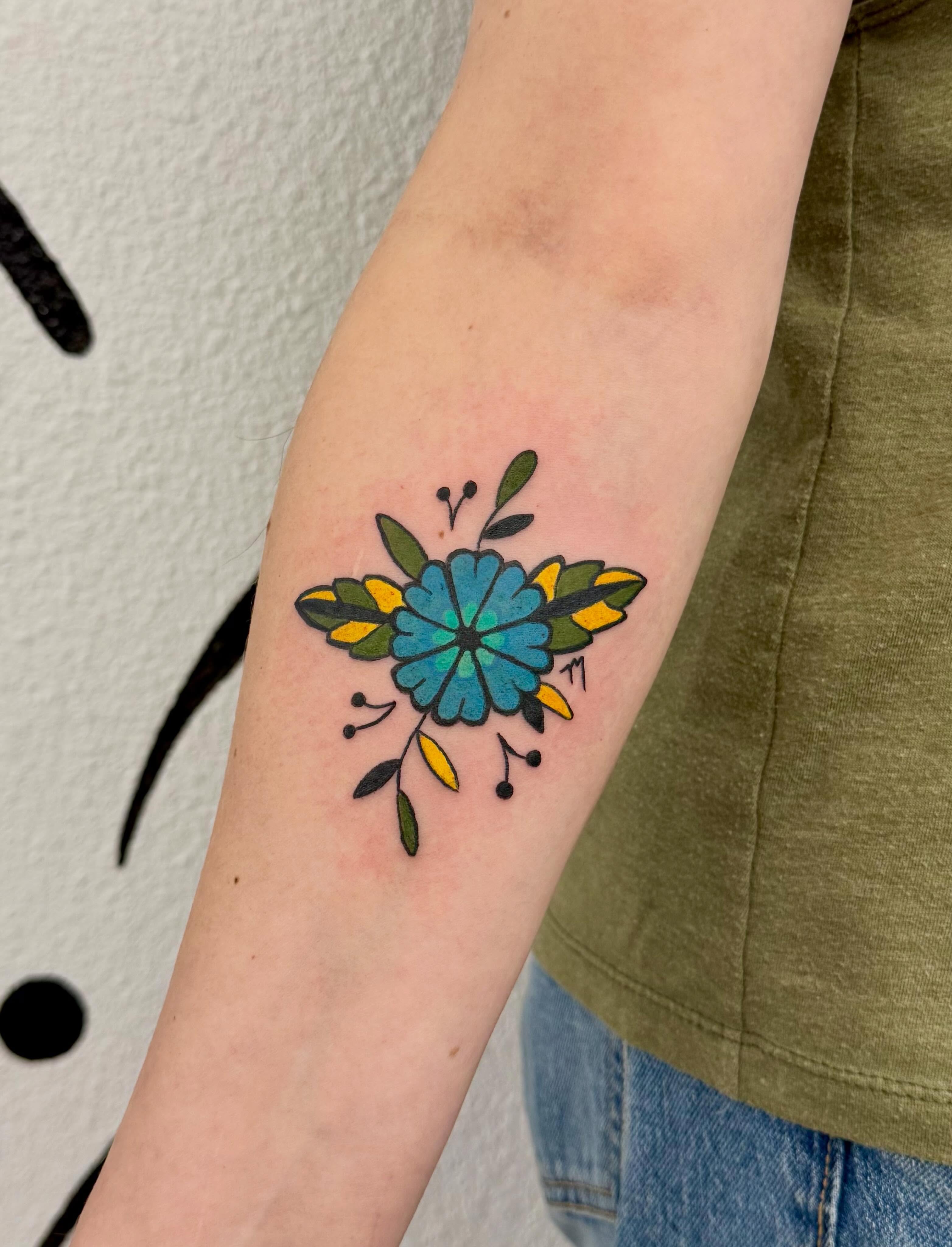 Floral design American traditional tattoo on the forearm by Peggy