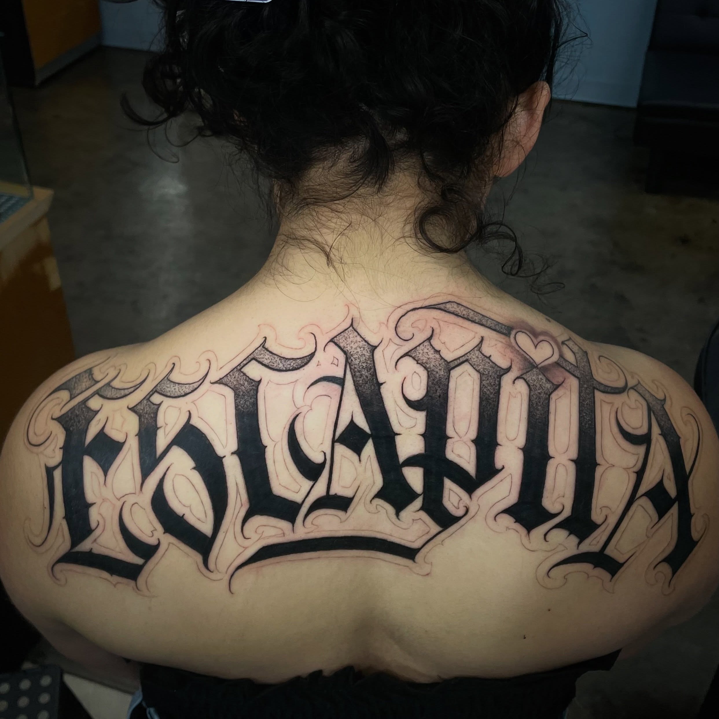 Script lettering lettering script tattoo on the back by Shadoww Espinoza