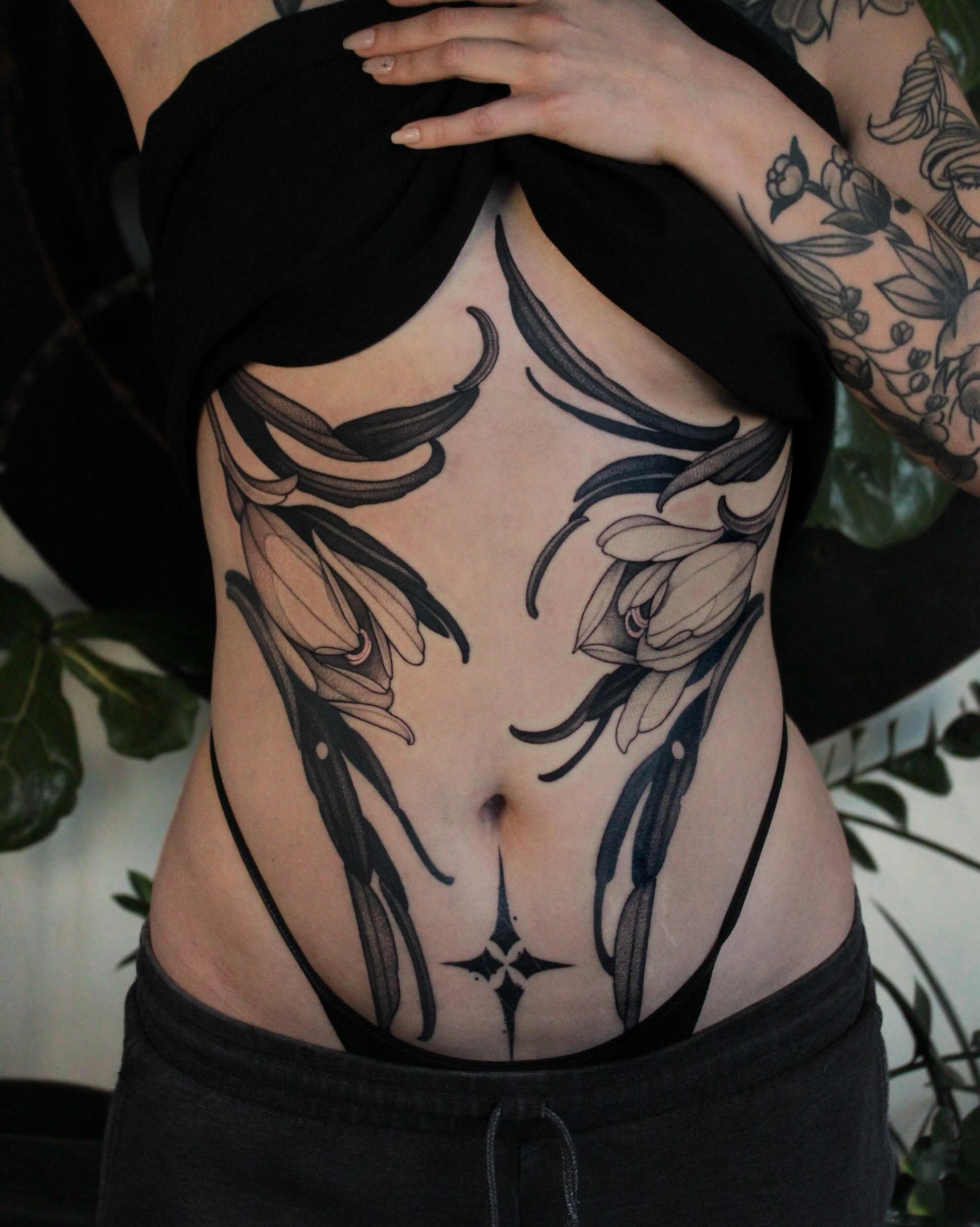 Floral black and grey tattoo on the ribs by Heather Apgar