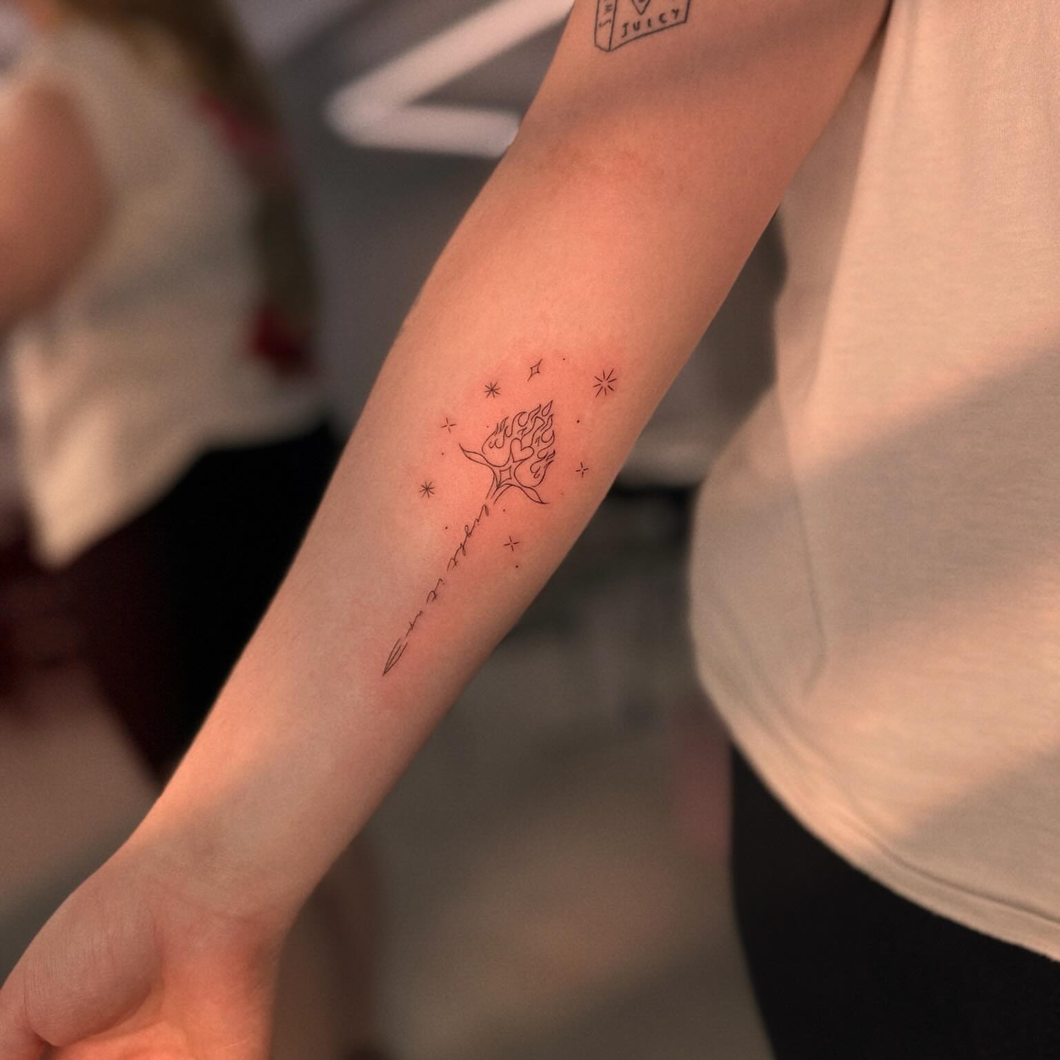 Tree with stars fine line tattoo on the forearm by Ellie