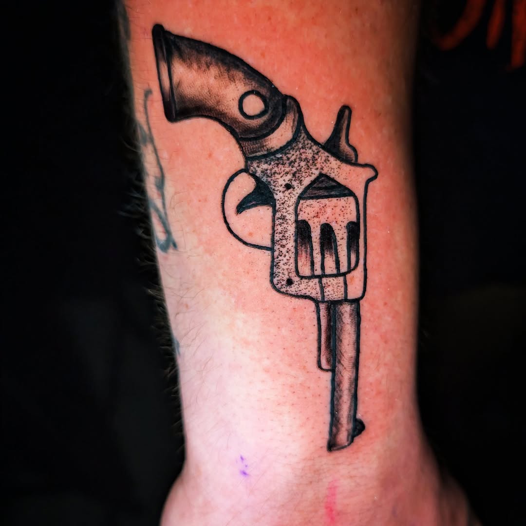 Revolver realism tattoo on the forearm by Matt Mahl