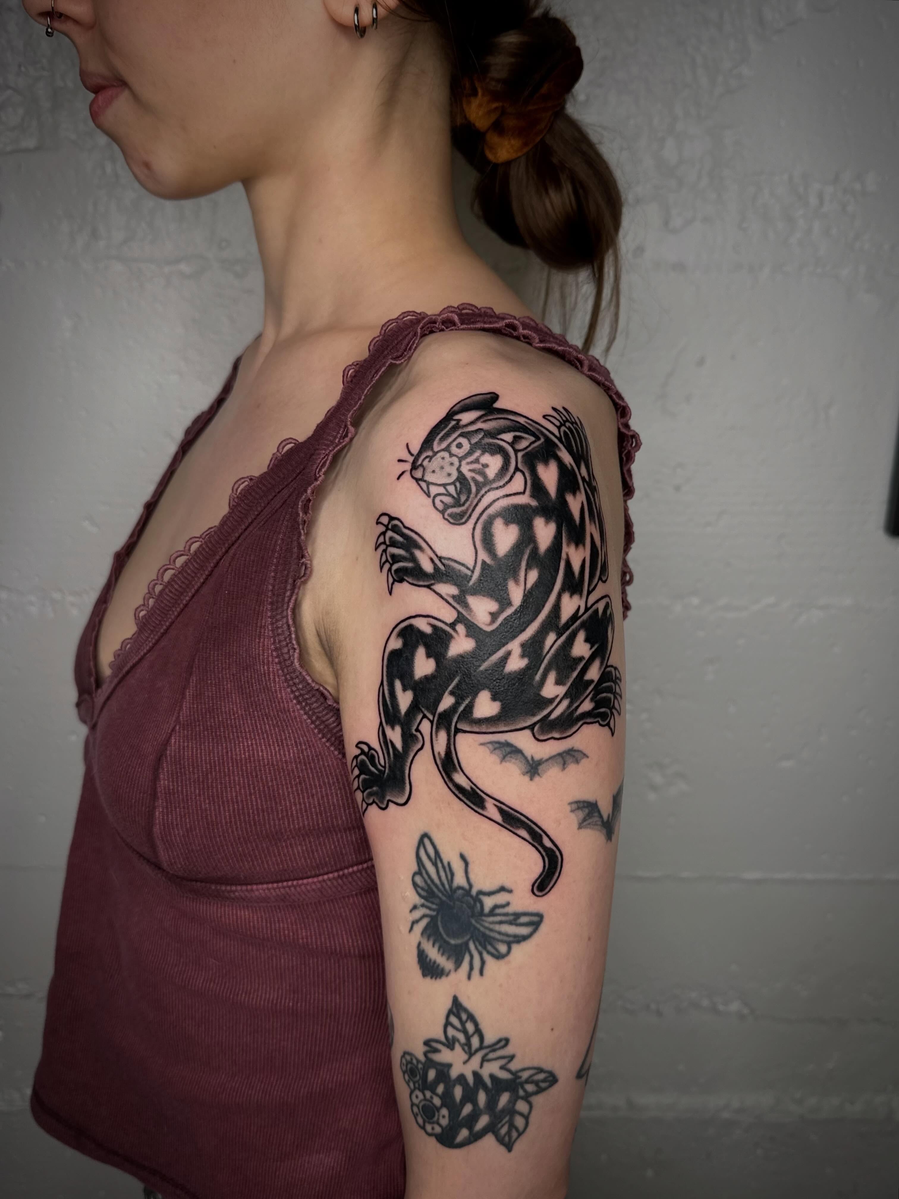 Panther black and grey tattoo on the shoulder by mia palau