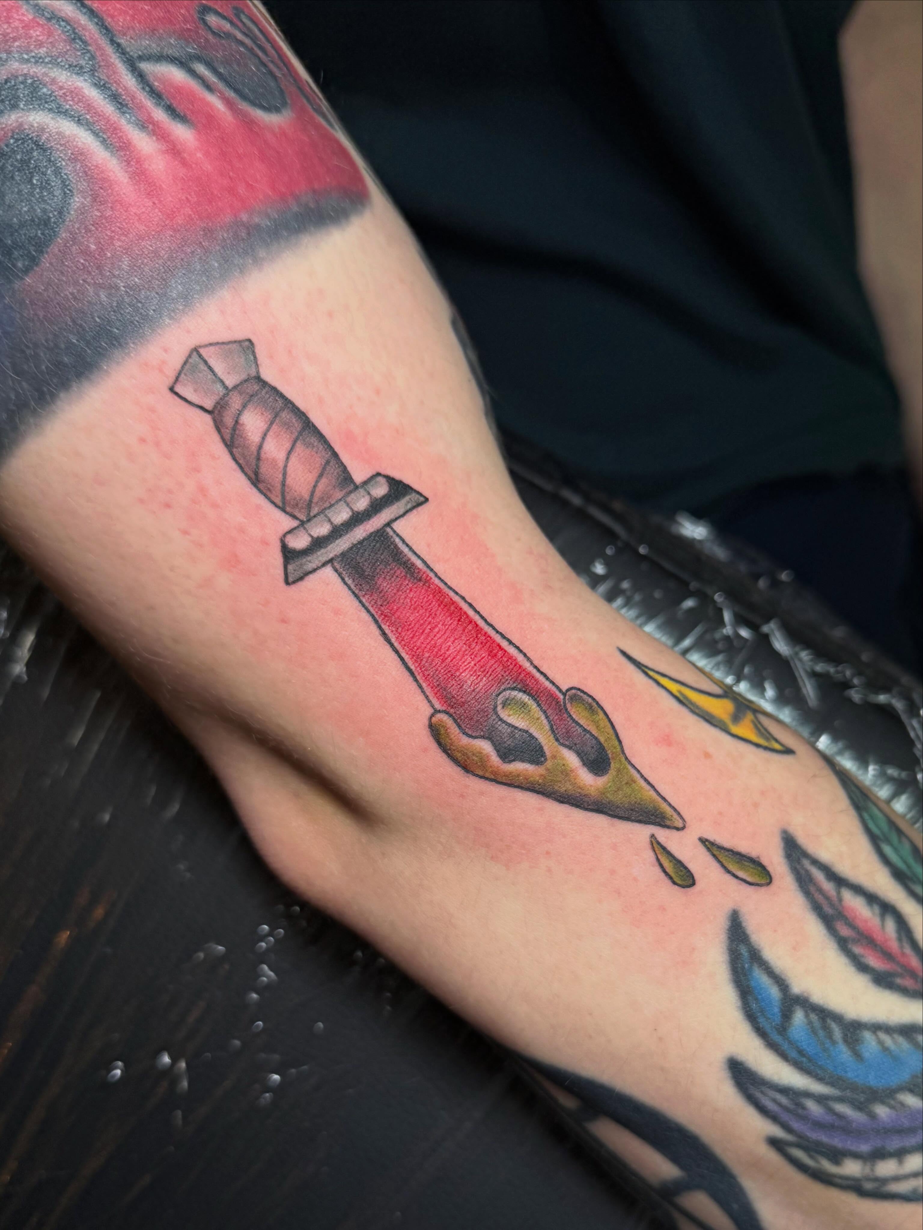 Knife with dripping blood realism tattoo on the forearm by βπ¬π―π’πΆ