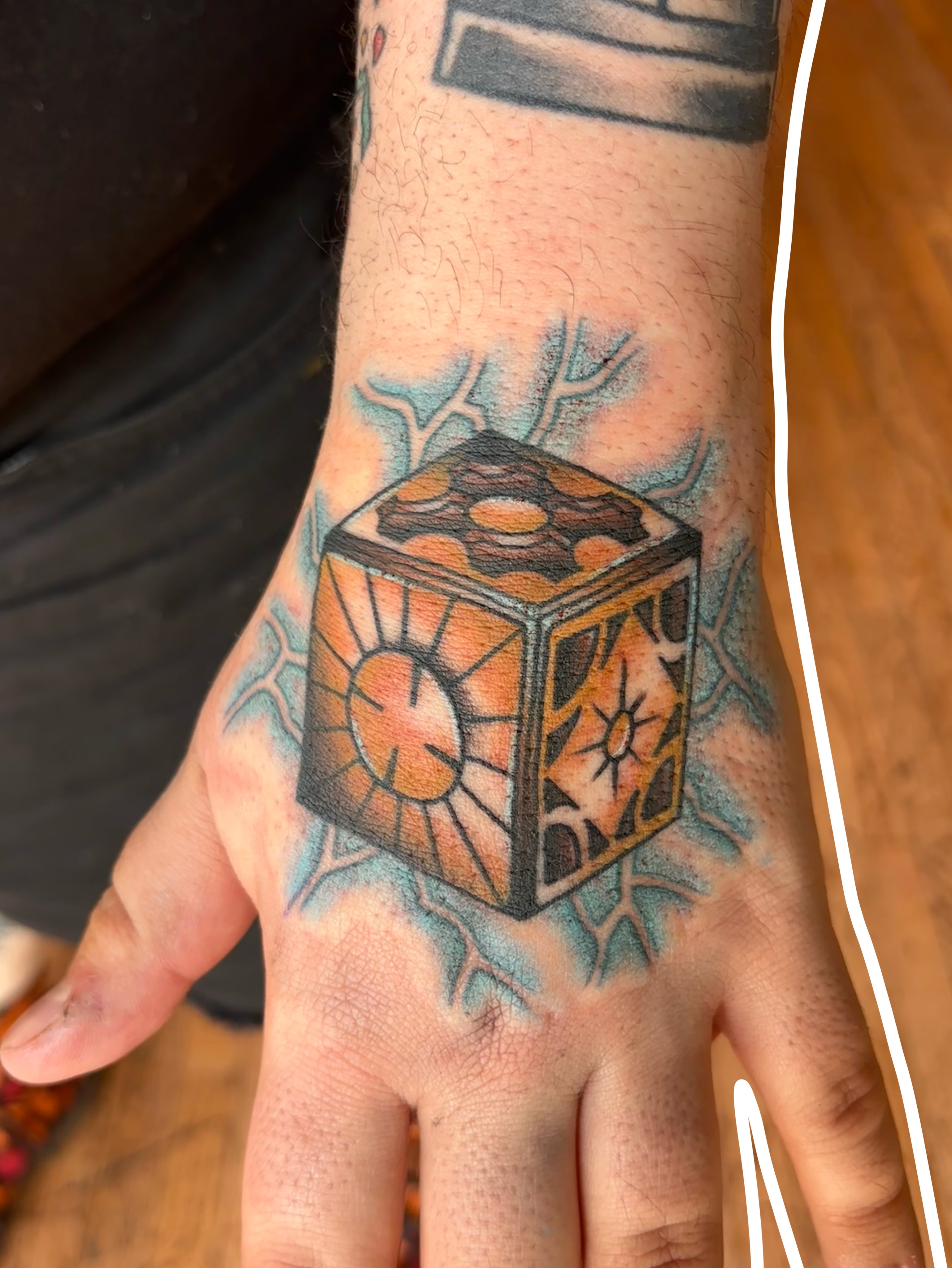 Cube geometric tattoo on the hand by Emmy Stepien