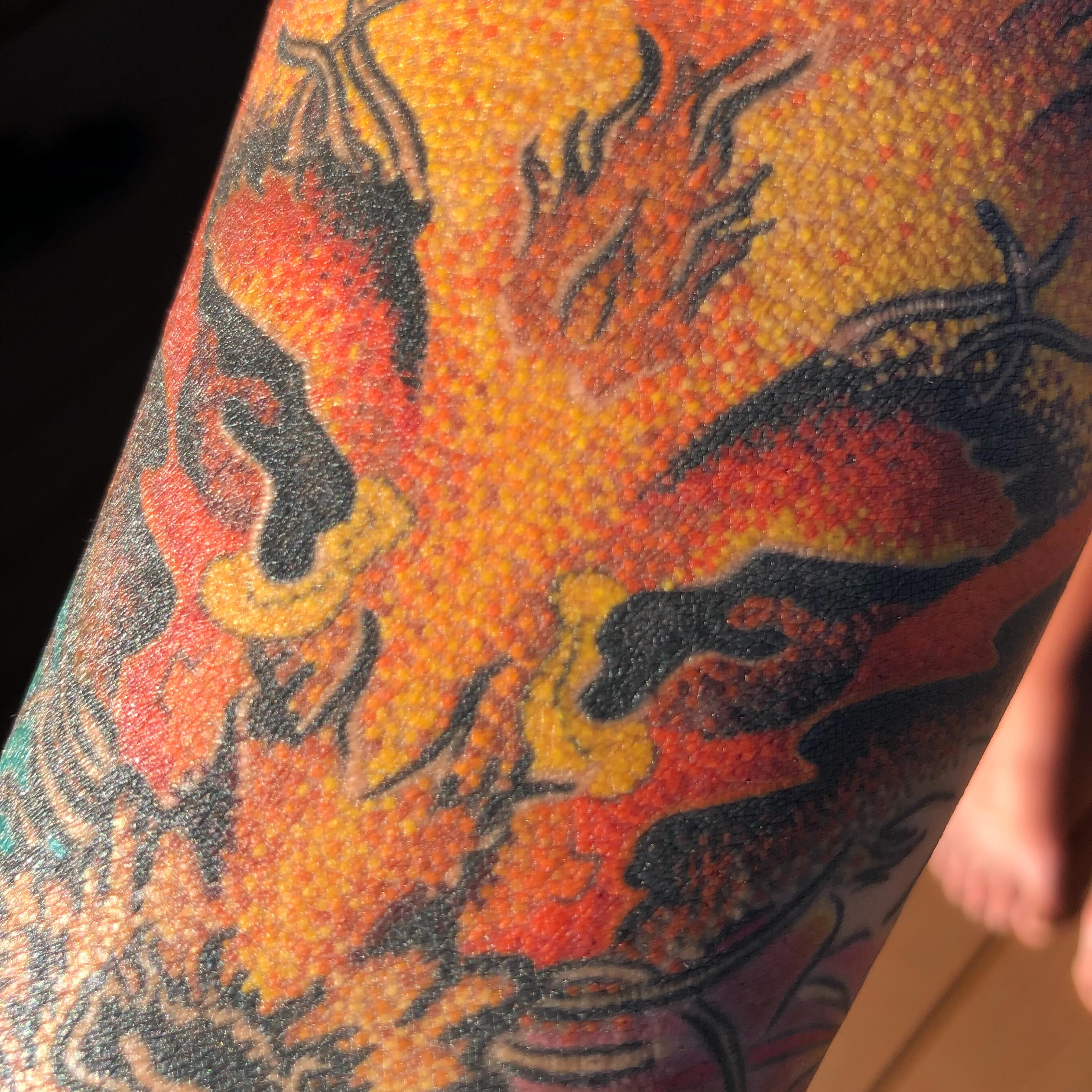 Flame dotwork tattoo on the upper arm by LiteBriteTattoo, Salt Lake City, Utah