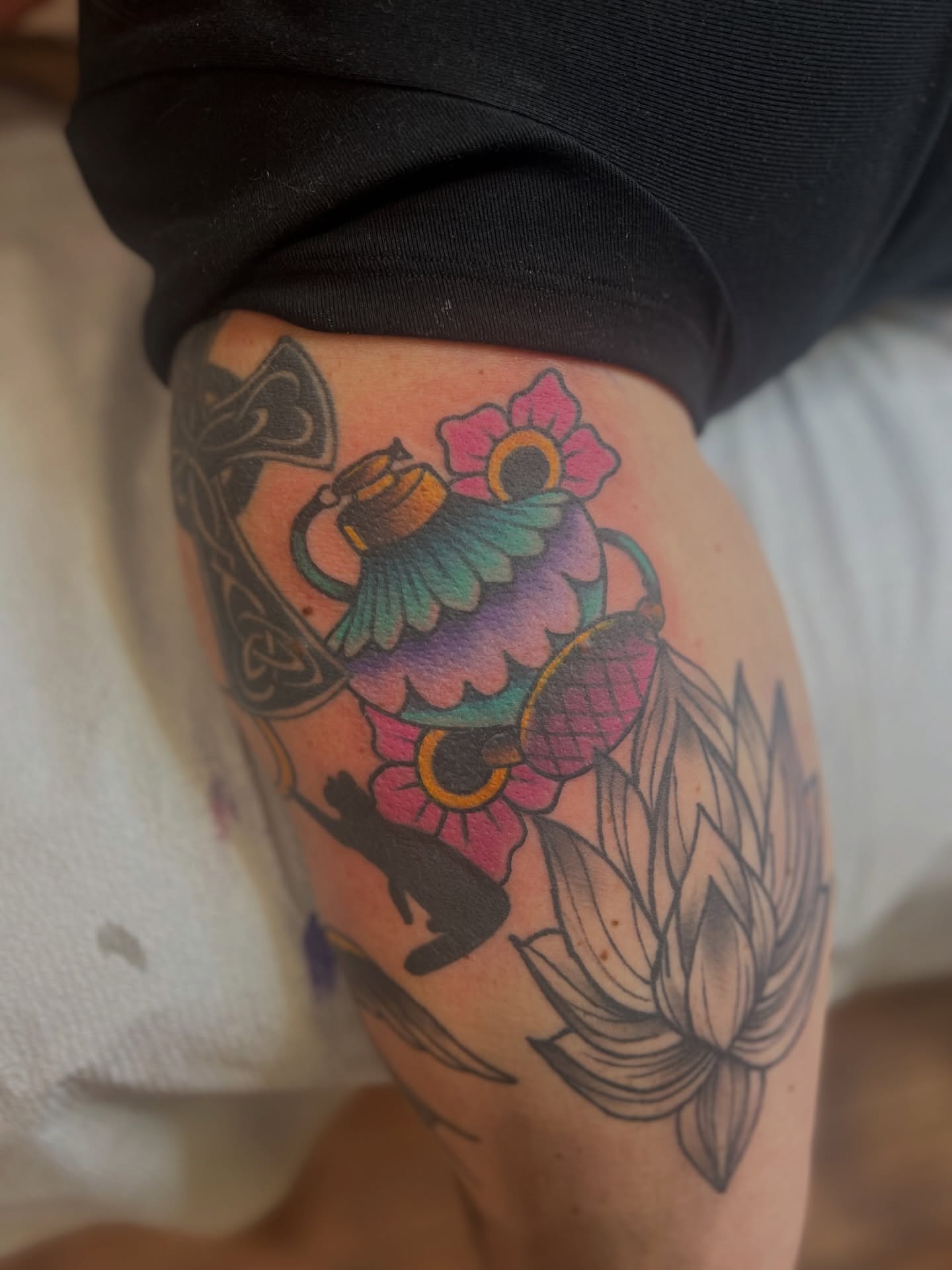Flower and bird new school tattoo on the thigh by Fizzy Jizzles, Worcester, England