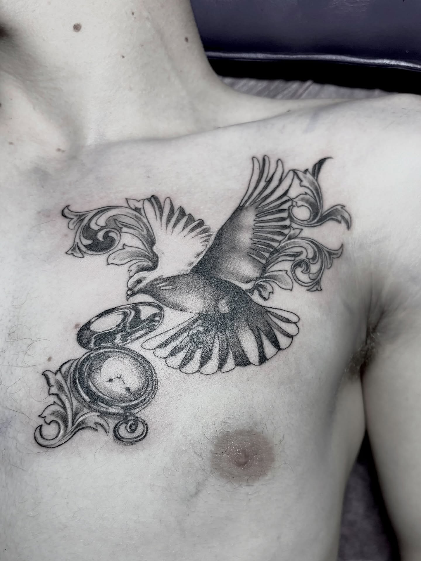 Bird and clock ornamental tattoo on the chest by <3 eve’s tattoos <3
