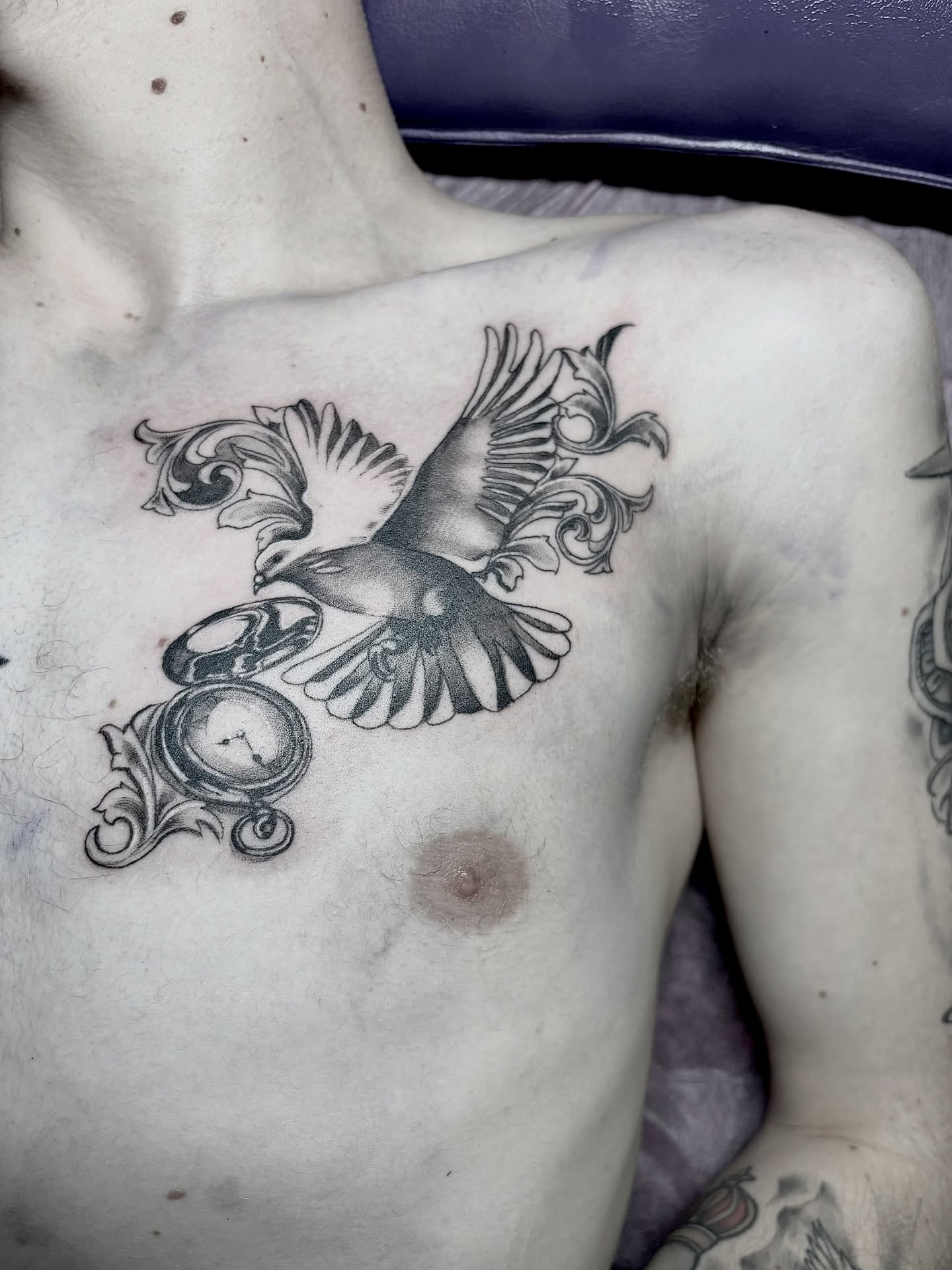 Bird and clock ornamental tattoo on the chest by <3 eve’s tattoos <3