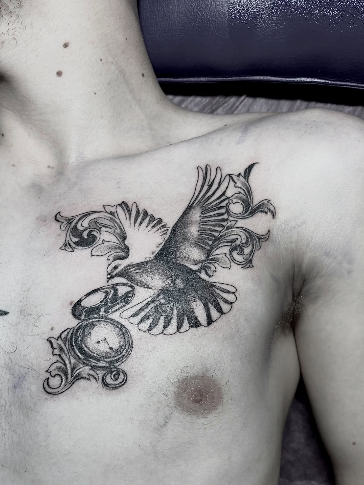 Bird and clock ornamental tattoo on the chest by <3 eve’s tattoos <3