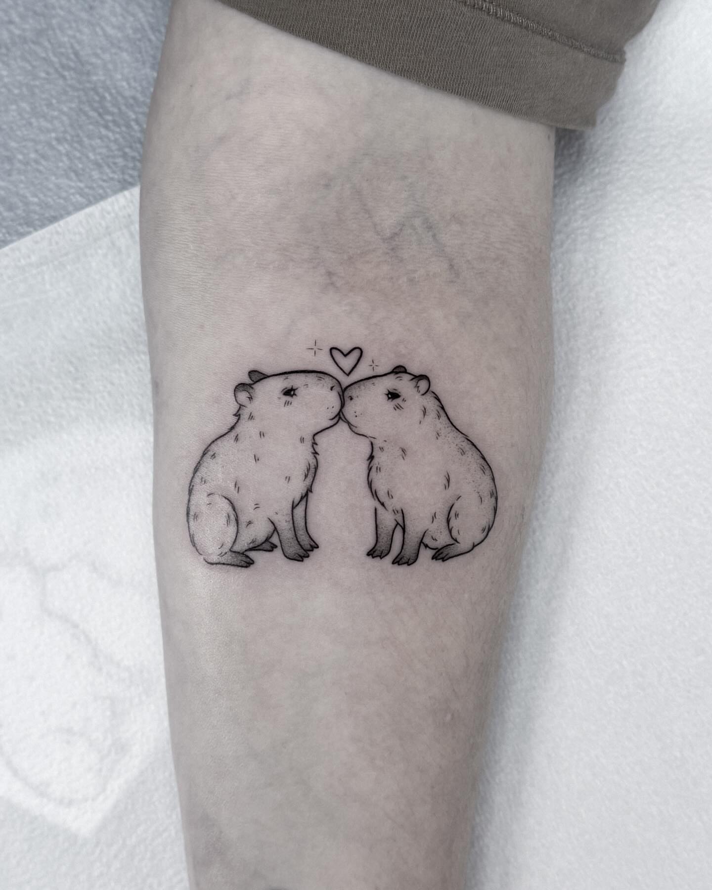 Groundhogs black and grey tattoo on the forearm by Whimsical Tattoos