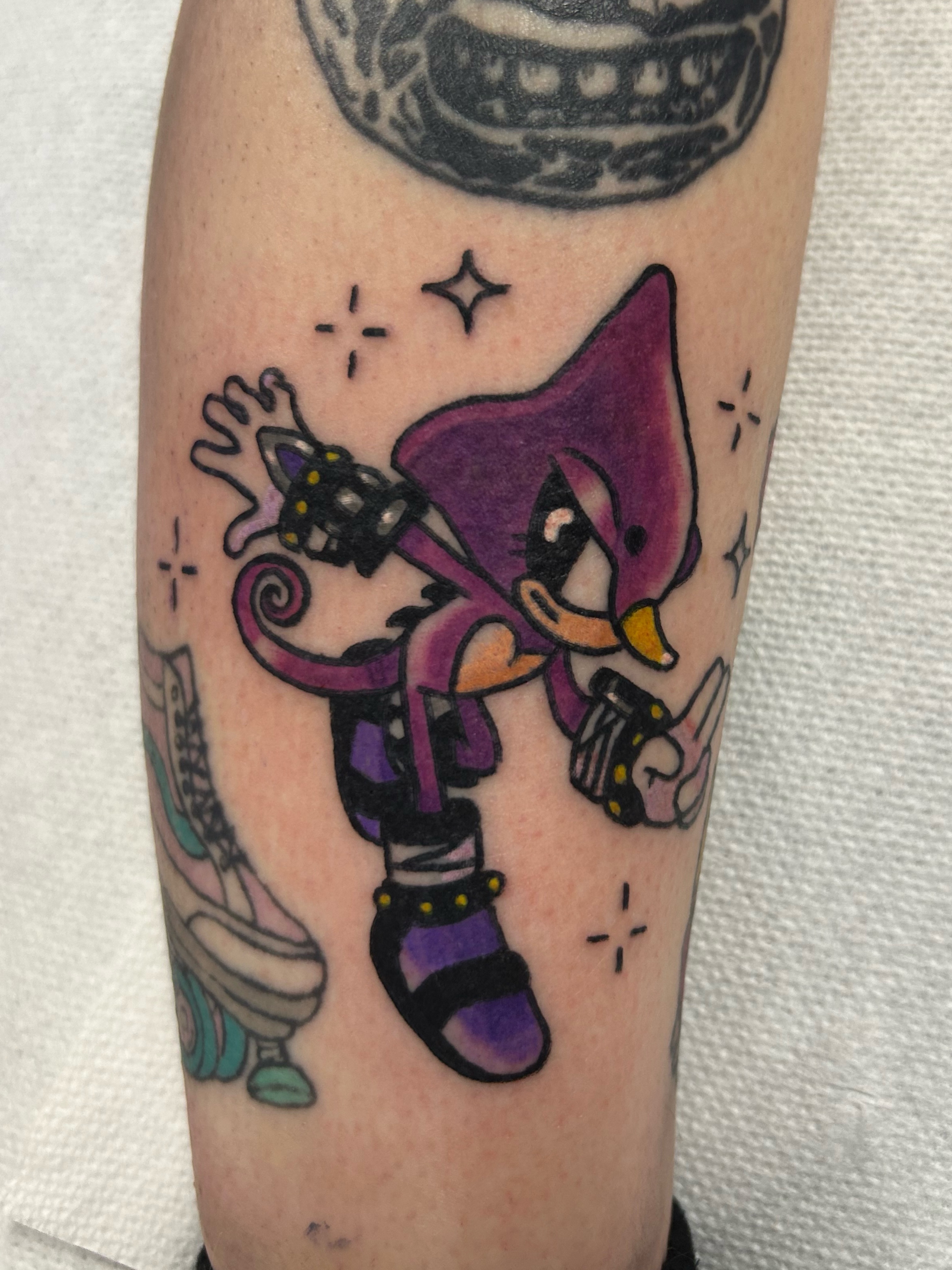 Chibi character dotwork tattoo on the forearm by Ollie