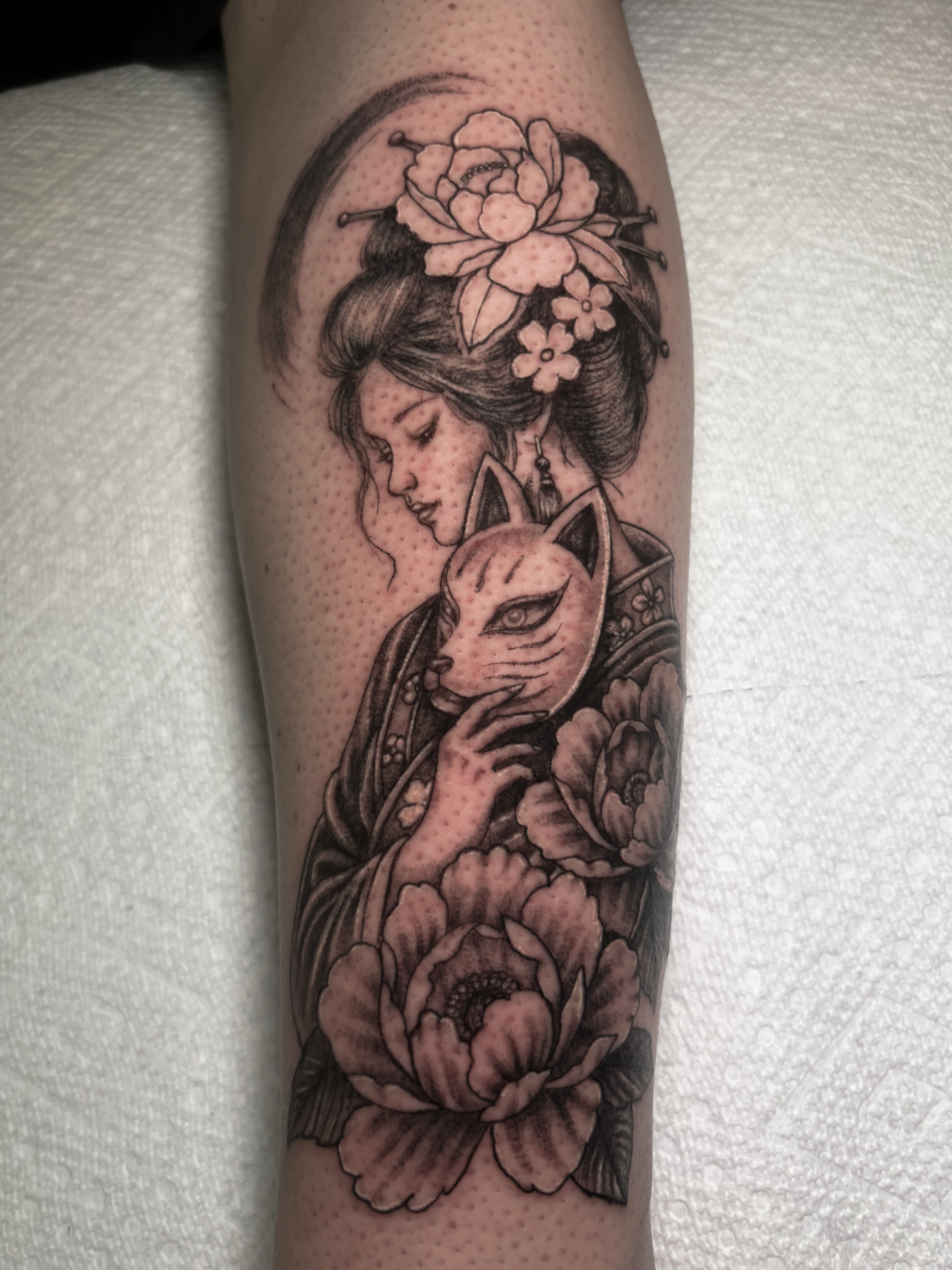 Geisha and fox dotwork tattoo on the forearm by Sal