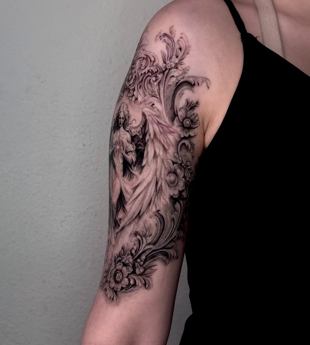 Angel with floral ornaments realism tattoo on the forearm by josselyn ☪︎