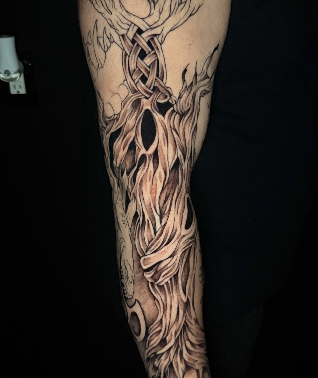 Flame and knot geometric tattoo on the forearm by Exploitedtattoos