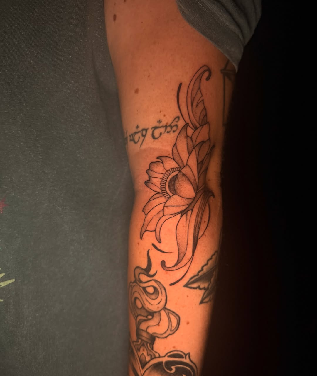 Lotus flower black and grey tattoo on the forearm by Exploitedtattoos