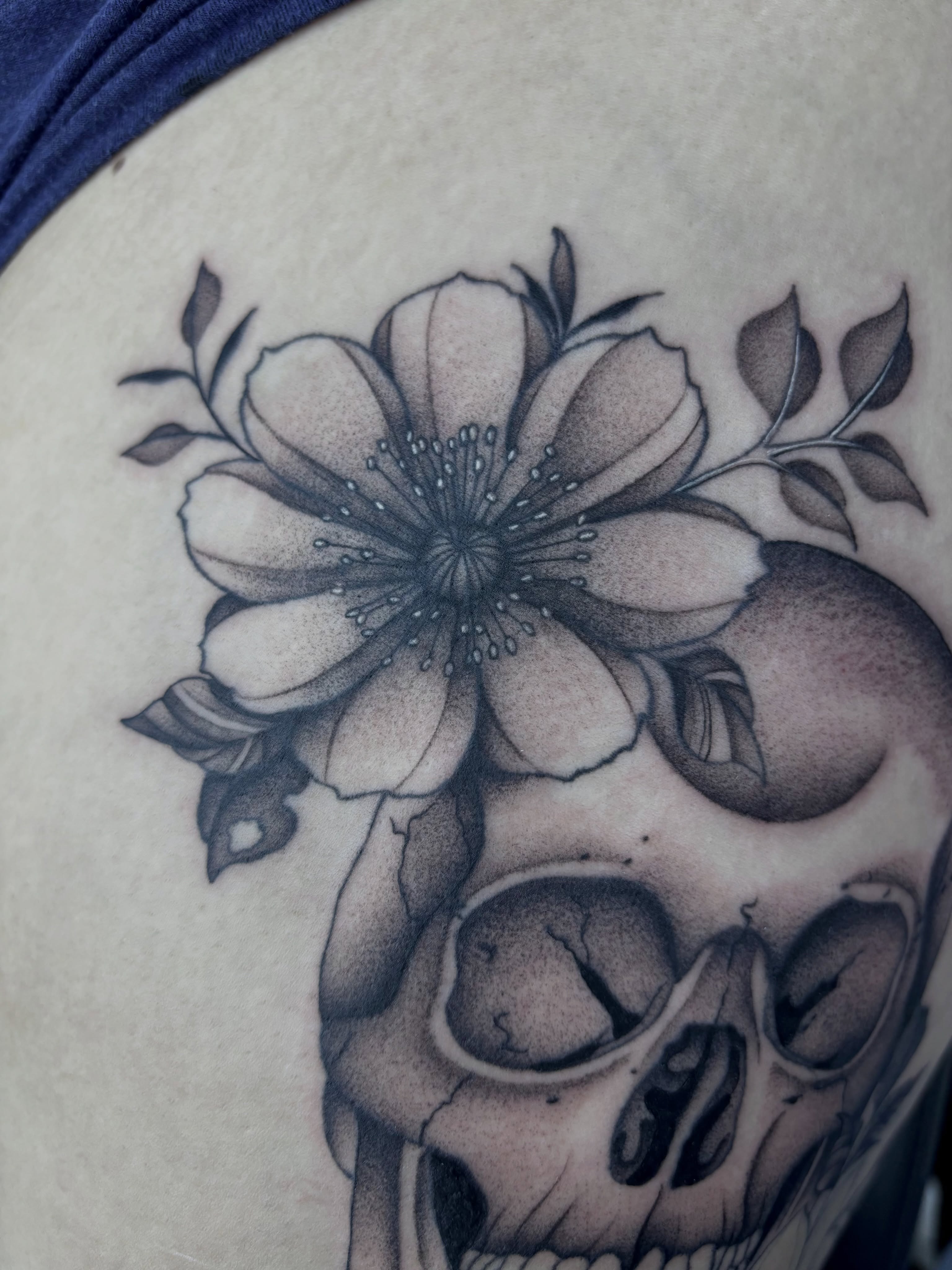 Flower and skull dotwork tattoo on the thigh by Elise Lamoureux- Tattoo Artist, Airdrie, Alberta