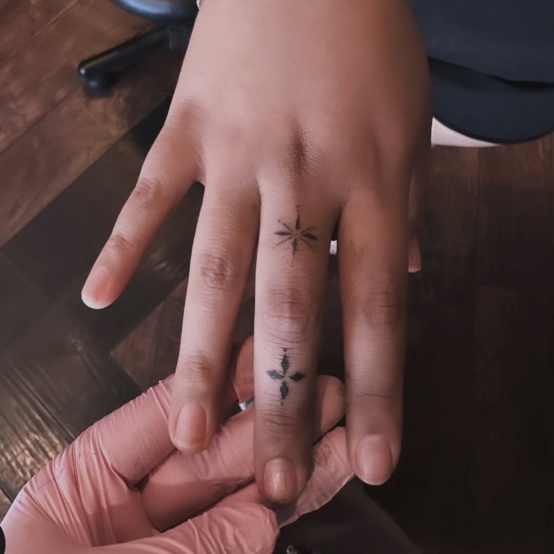 Compass rose and cross ornamental tattoo on the hand by Cielle