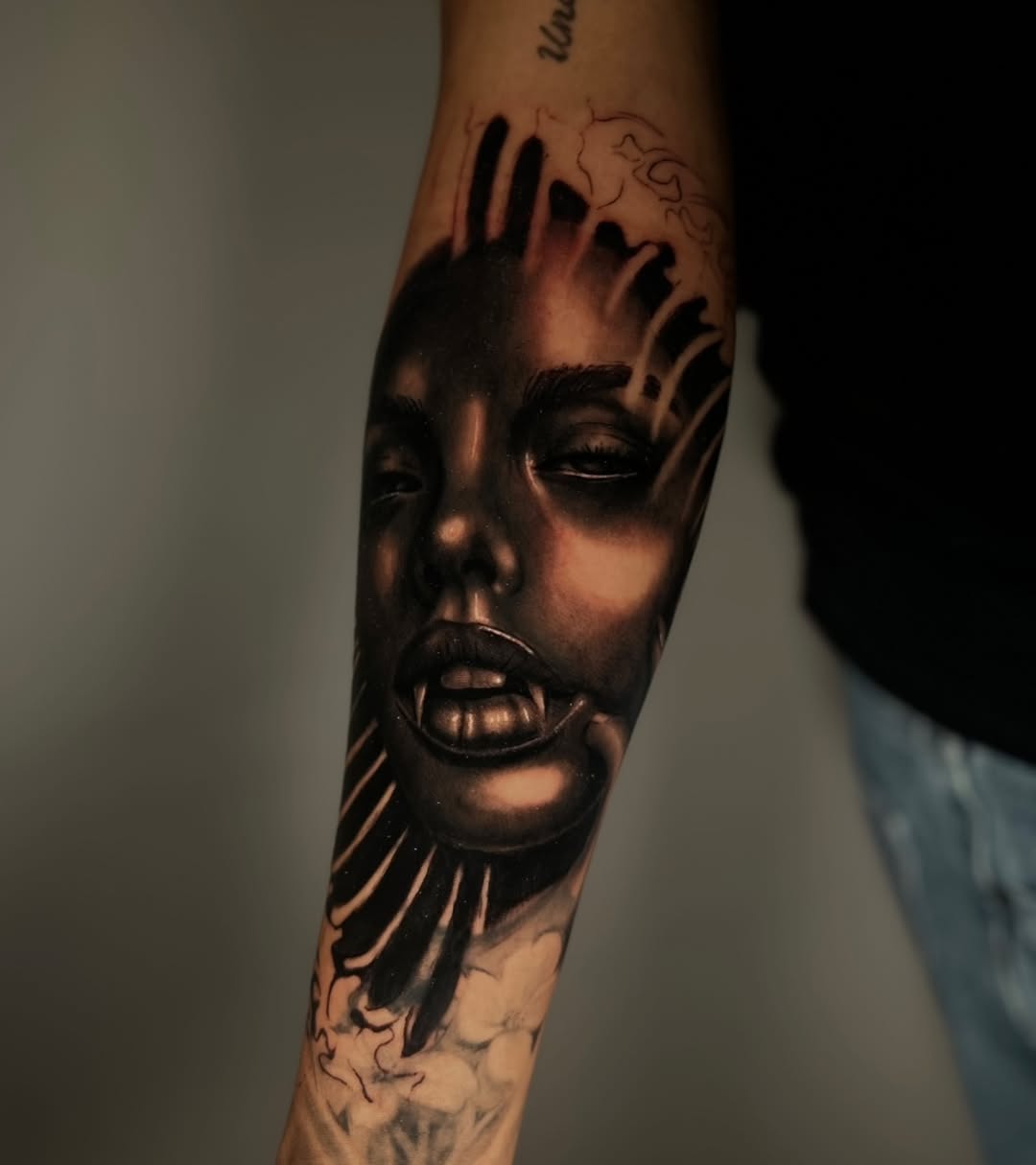Vampire face realism tattoo on the forearm by ᴅᴀʟʟᴀꜱ ᴛᴀᴛᴛᴏᴏ ᴀʀᴛɪꜱᴛ