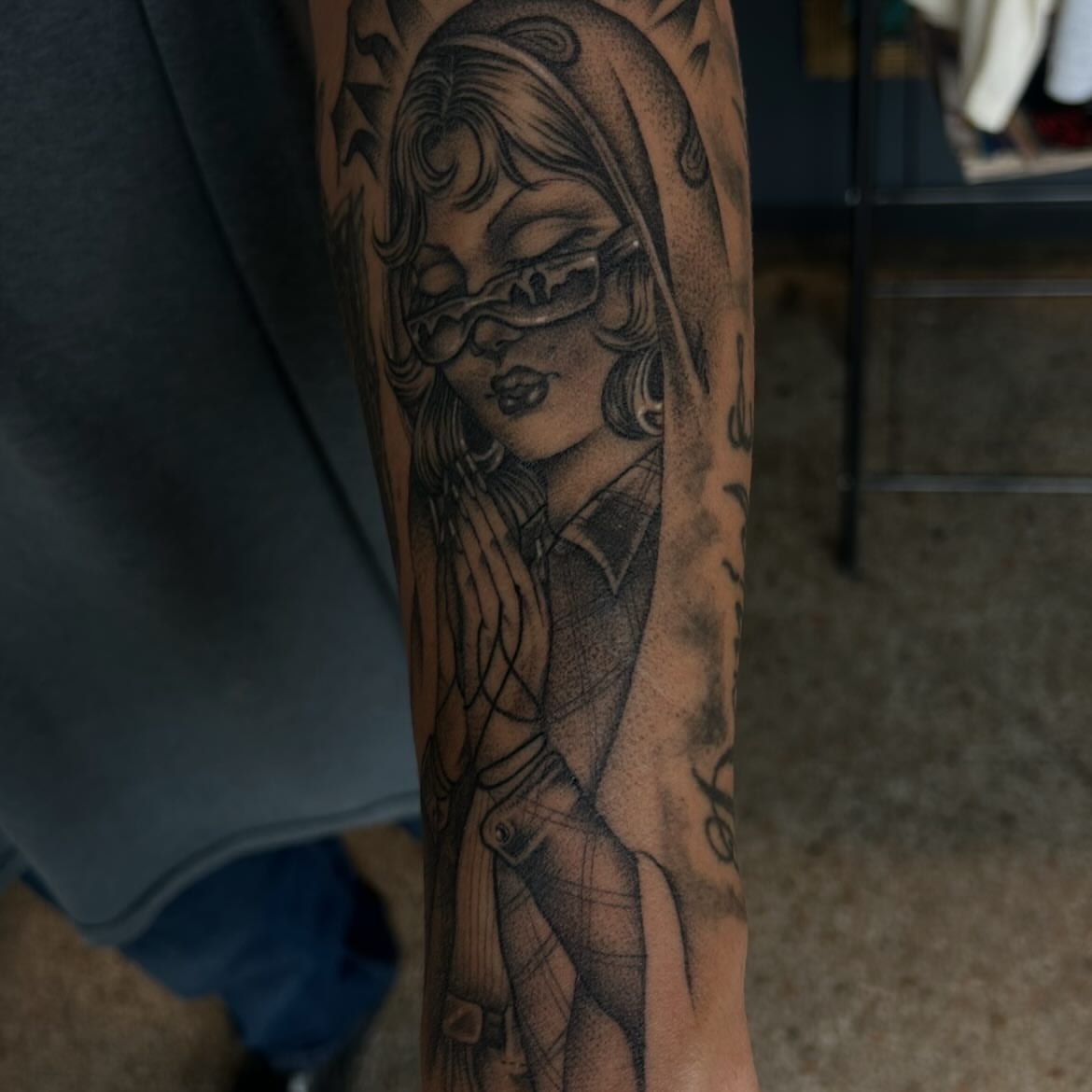 Woman with mask dotwork tattoo on the forearm by Sanjuanita