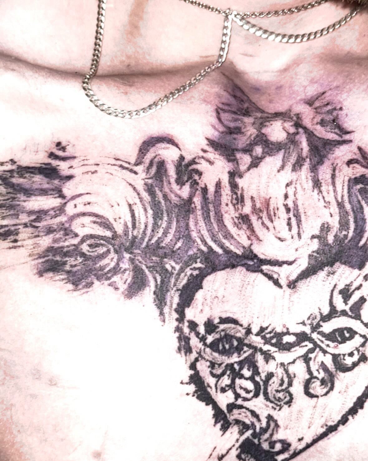 Waves and skull black and grey tattoo on the chest by @douohv