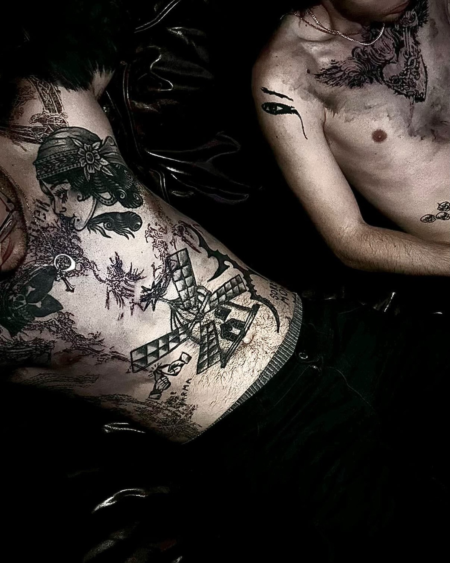 Windmill black and grey tattoo on the upper arm by @douohv
