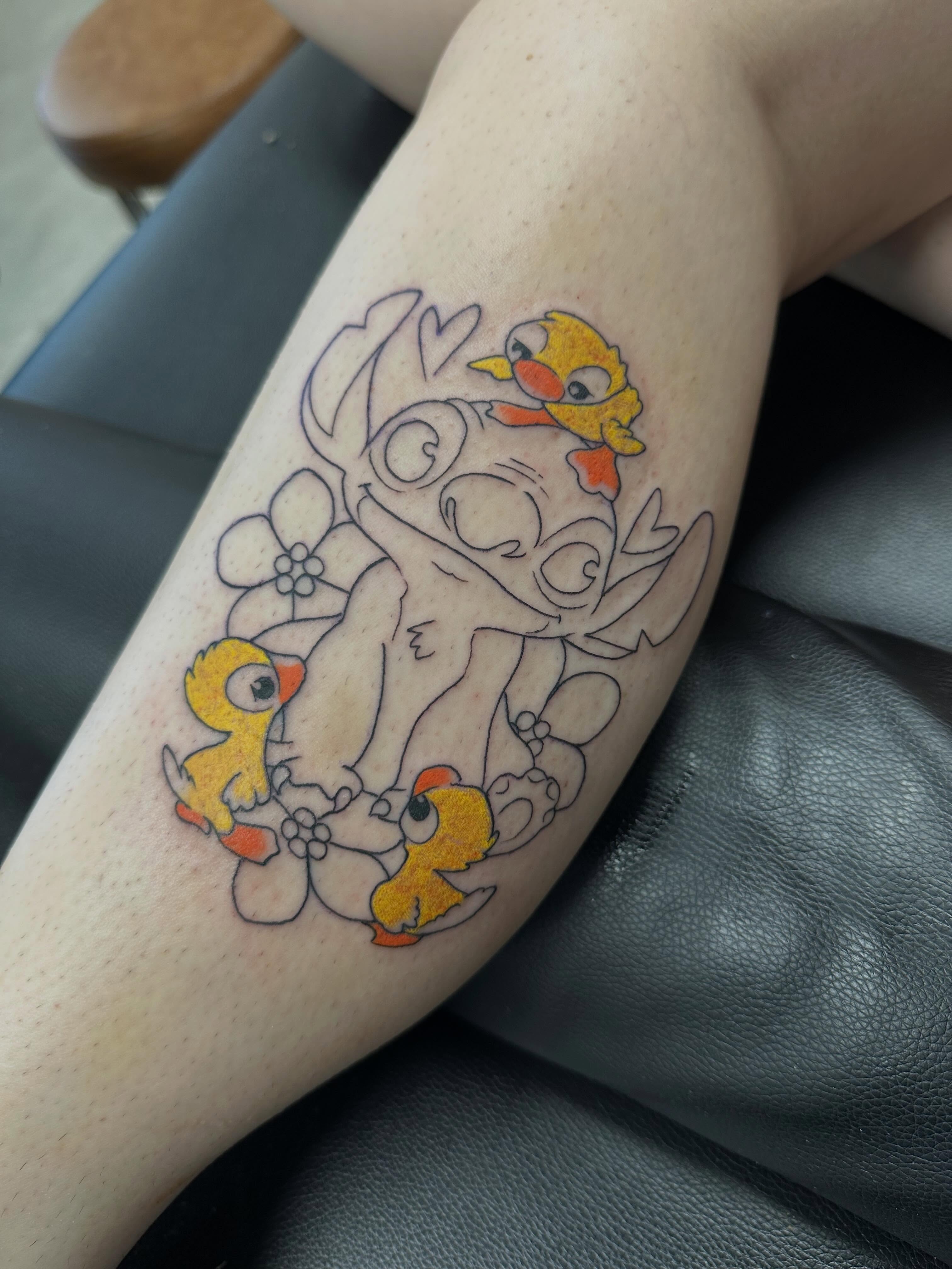 Lilo and Stitch with ducklings new school tattoo on the forearm by Vincent Merys