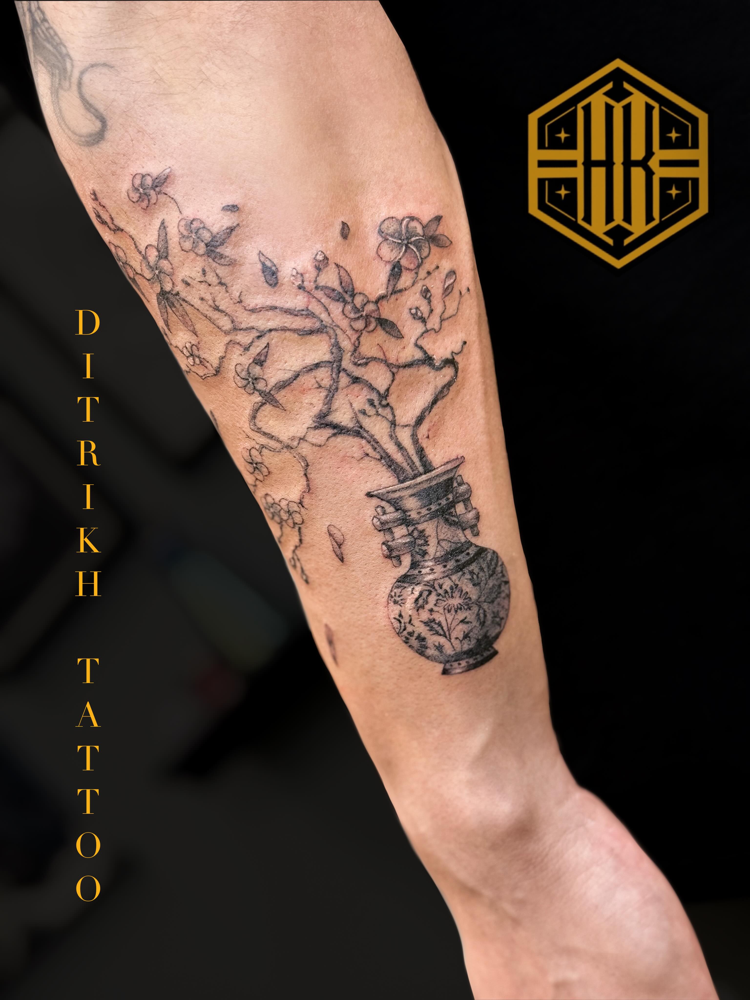 Vase with blossoms black and grey tattoo on the forearm by KET, Calgary, Alberta