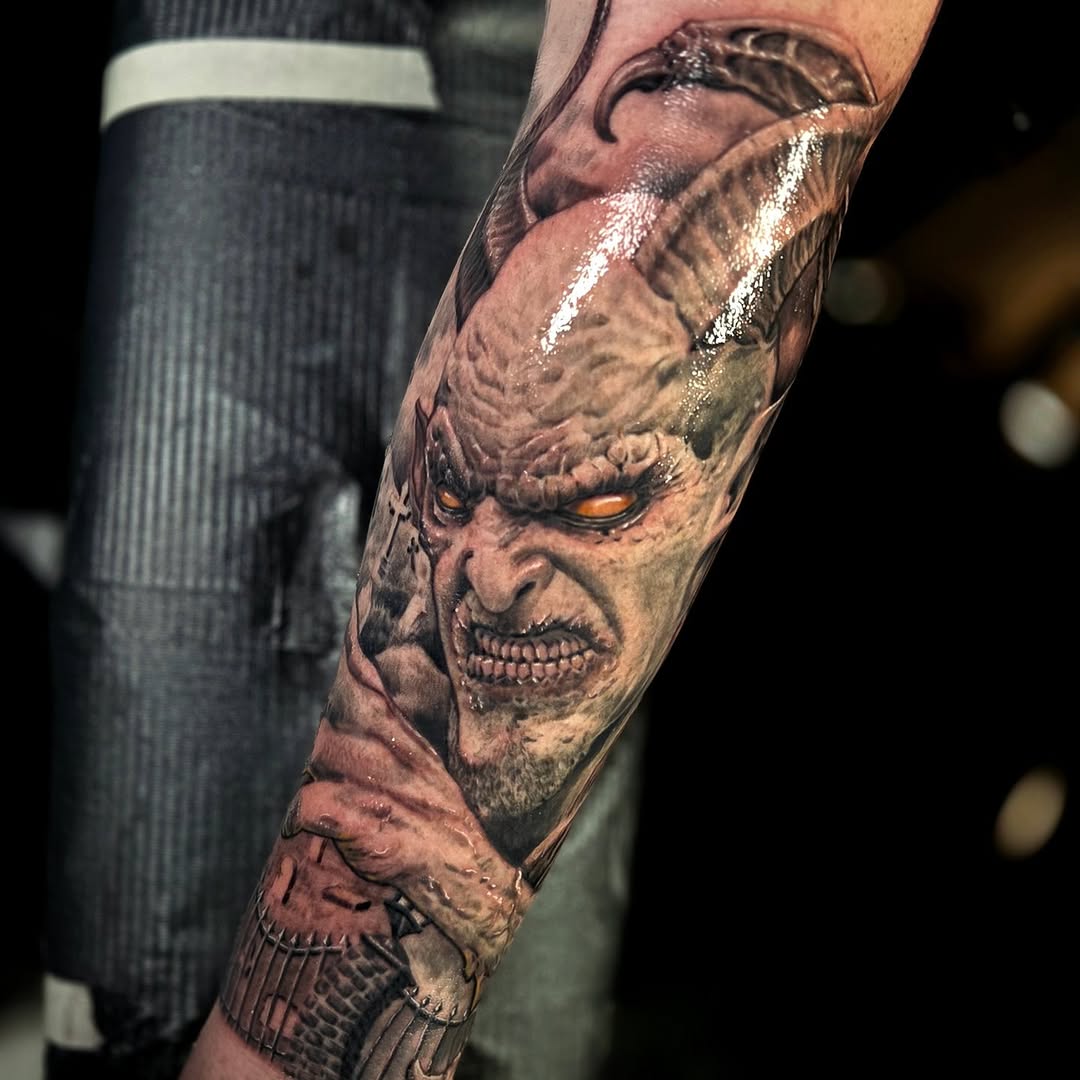 Demon face realism tattoo on the forearm by Jake Goss, Salt Lake City, Utah