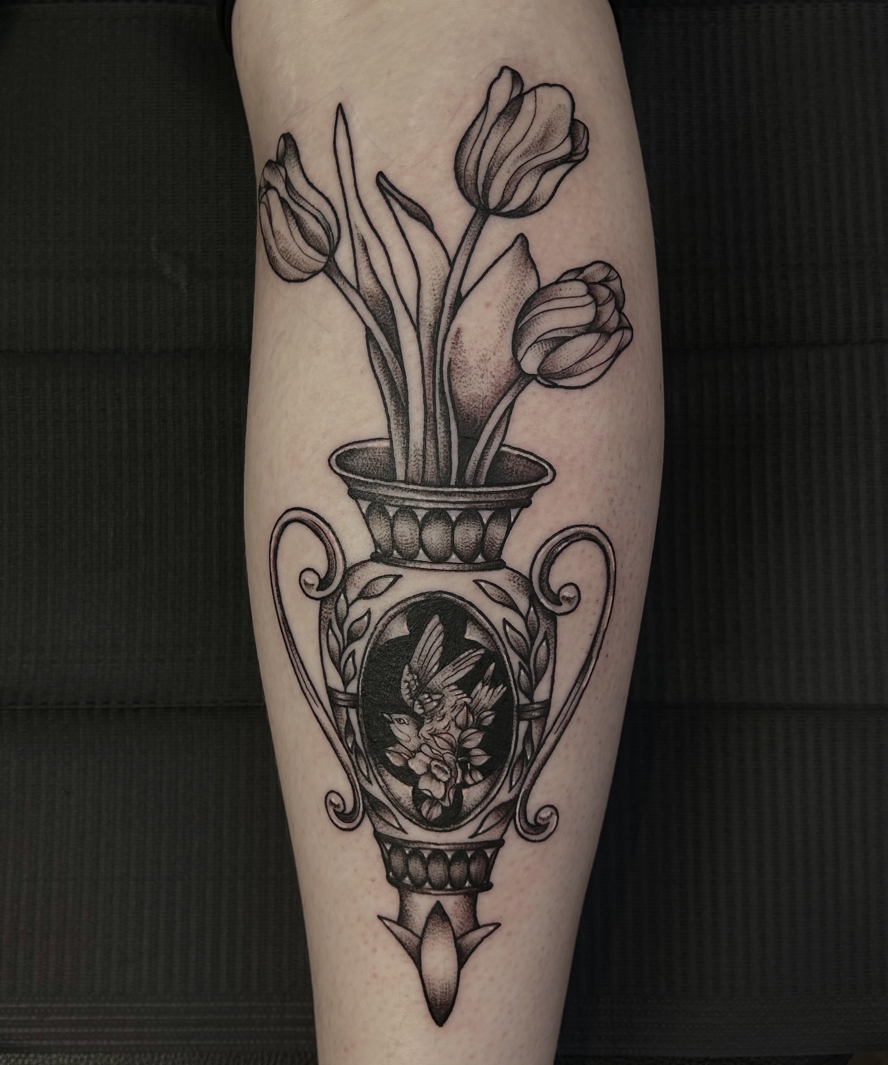 Vase with tulips realism tattoo on the forearm by abby ☽ marie