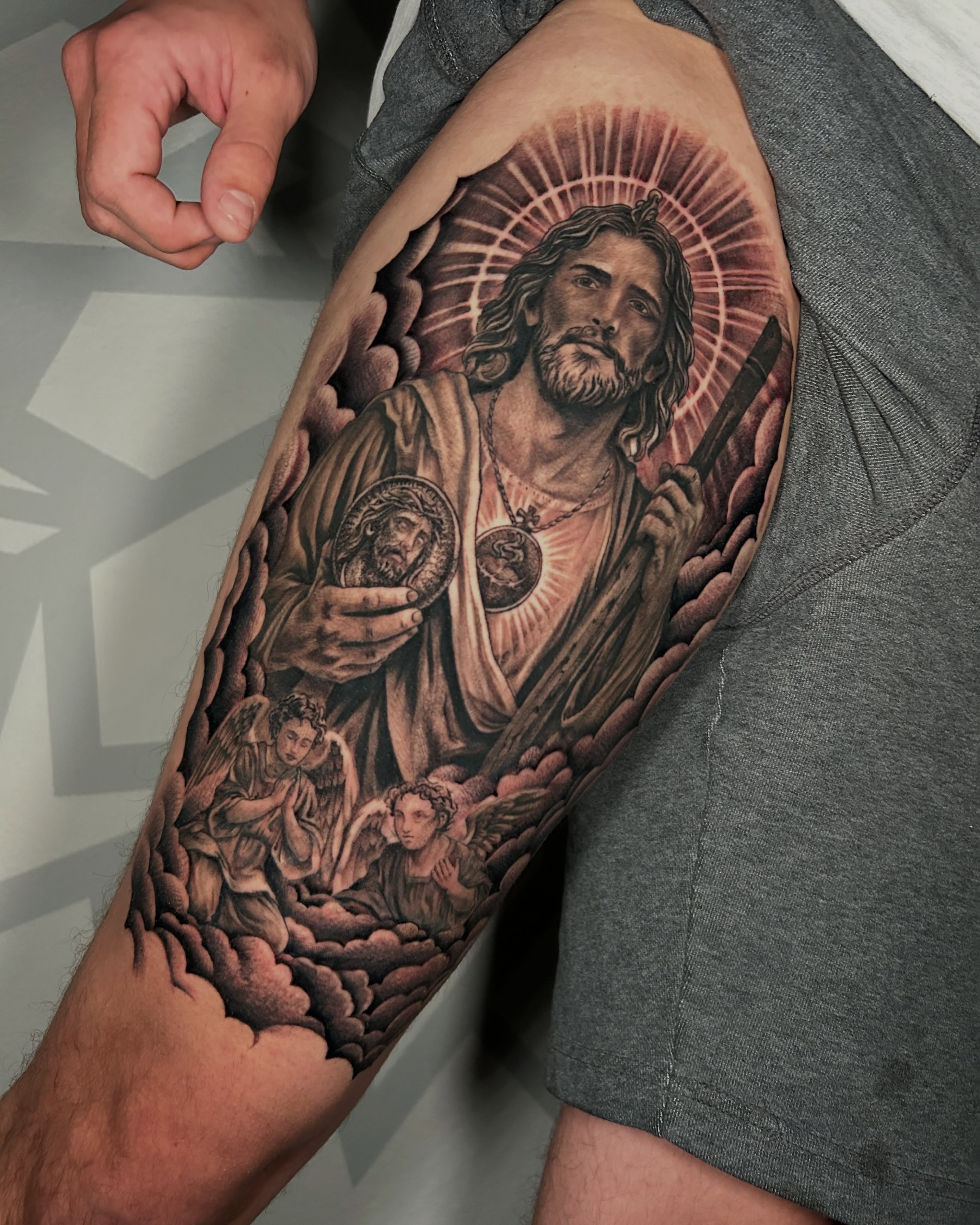 Religious figure with halo realism tattoo on the forearm by Las Vegas Tattoo Artist
