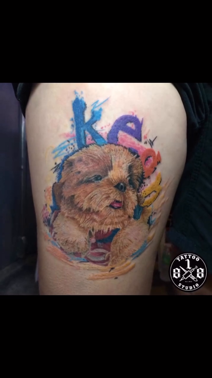 Dog portrait with watercolor splashes realism tattoo on the back by Ferds Villanueva