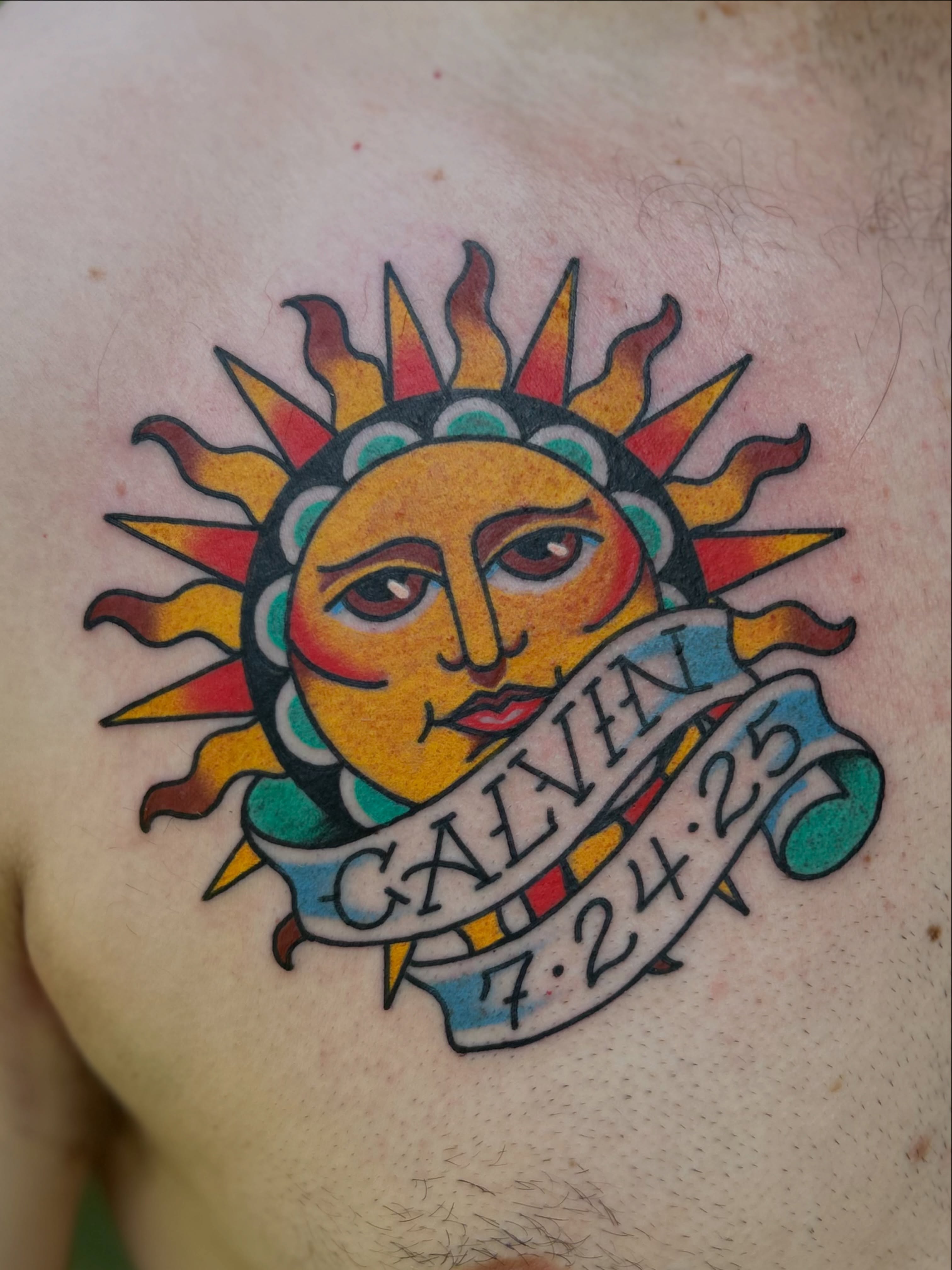 Sun with banner American traditional tattoo on the chest by Lauren Alexandra