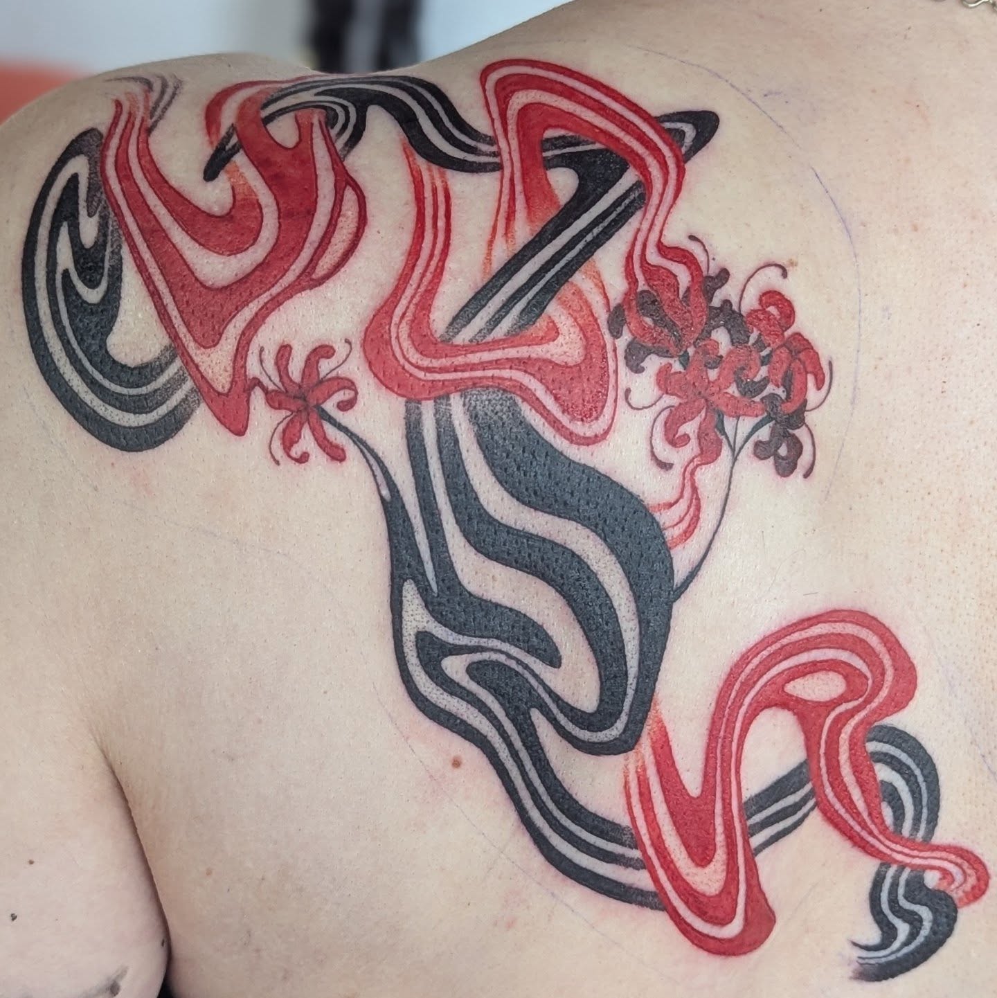 Abstract swirls new school tattoo on the shoulder by Spencer Jennings, Westland, Michigan