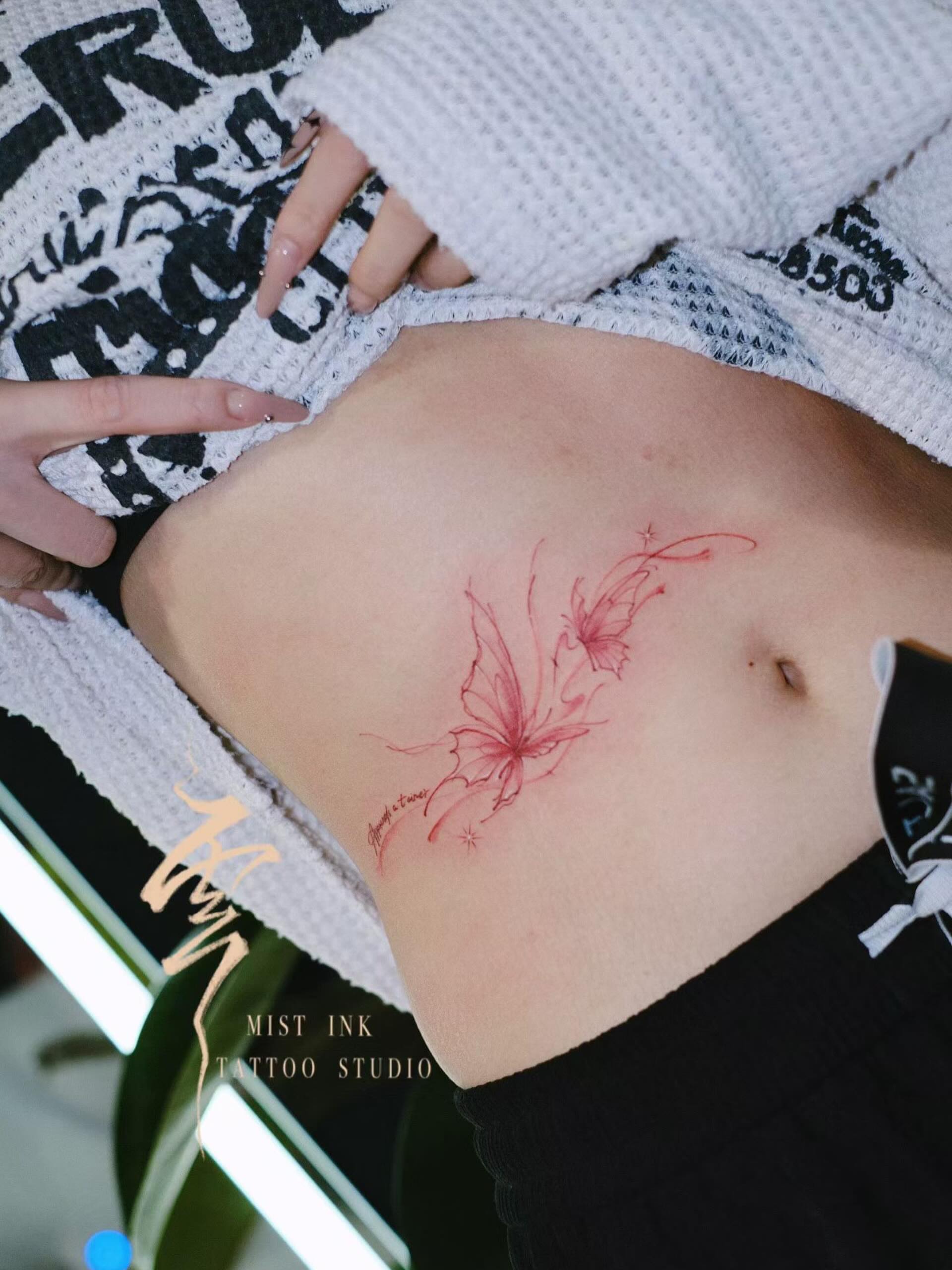 Butterfly fine line tattoo on the torso by Ink _daisy_