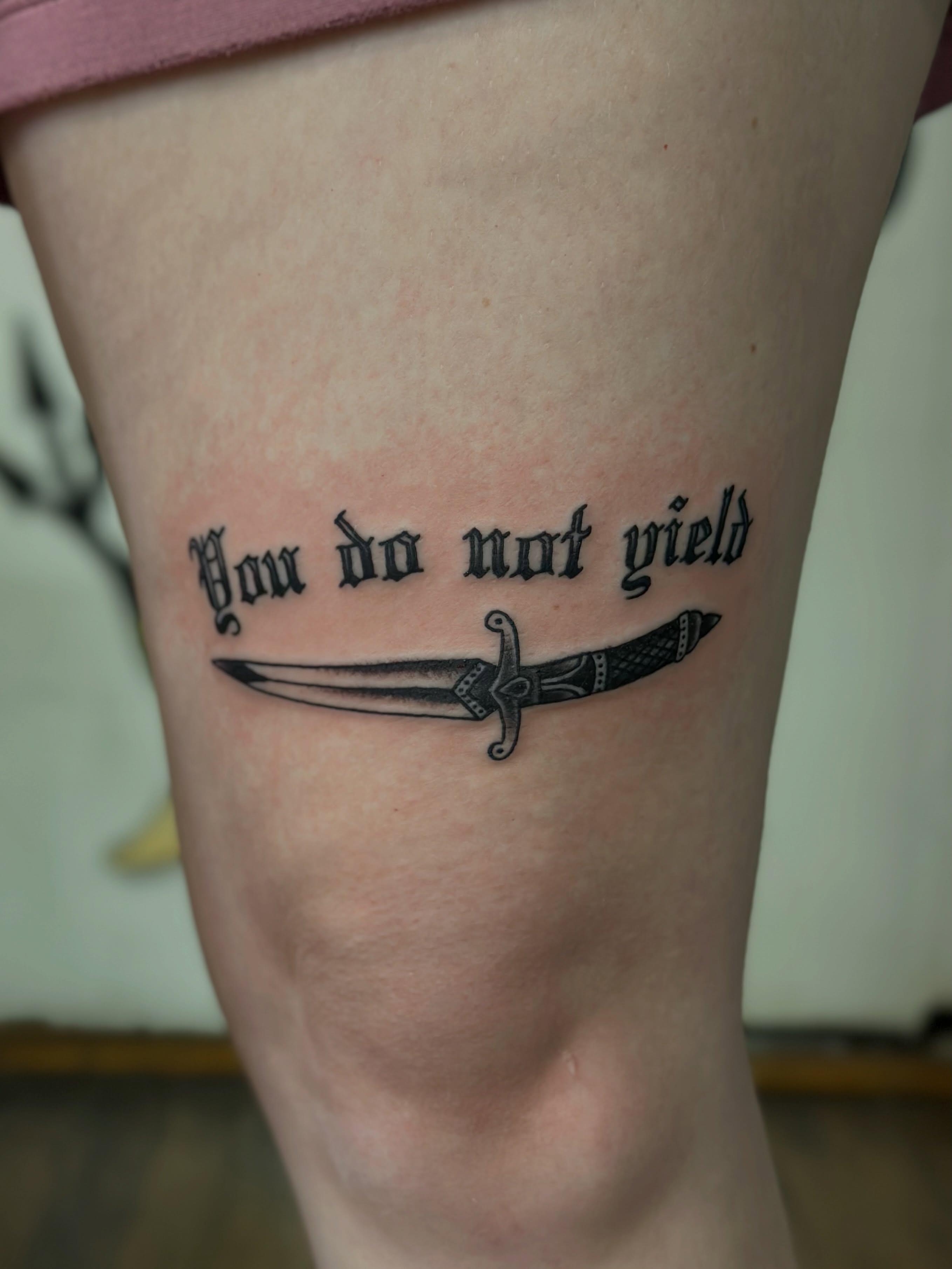 You do not yield black and grey tattoo on the thigh by Aaron ulfstam