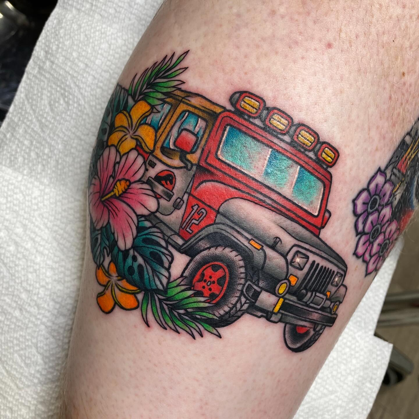 Fire truck American traditional tattoo on the thigh by Jarid Penn