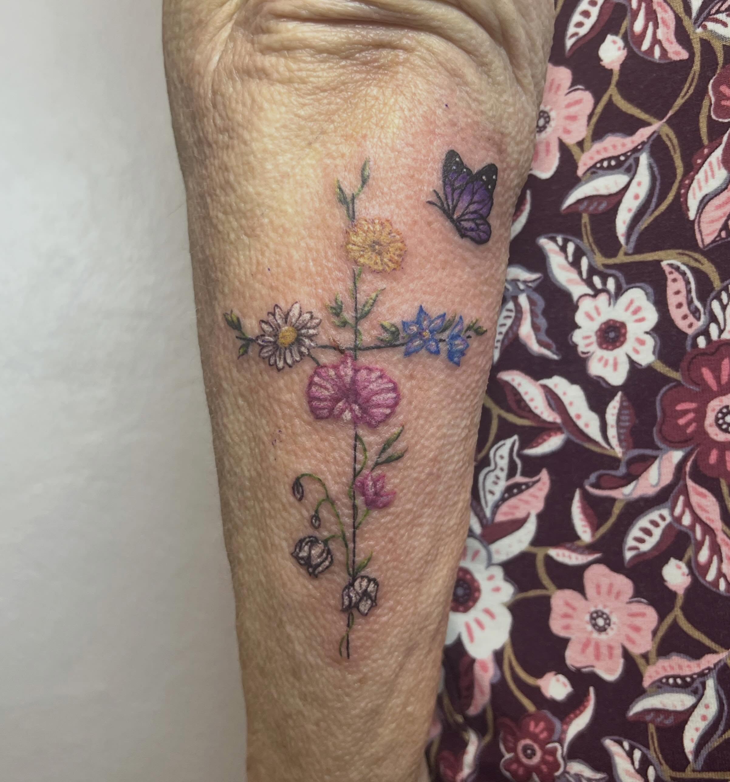 Floral arrangement dotwork tattoo on the forearm by Amber Rose