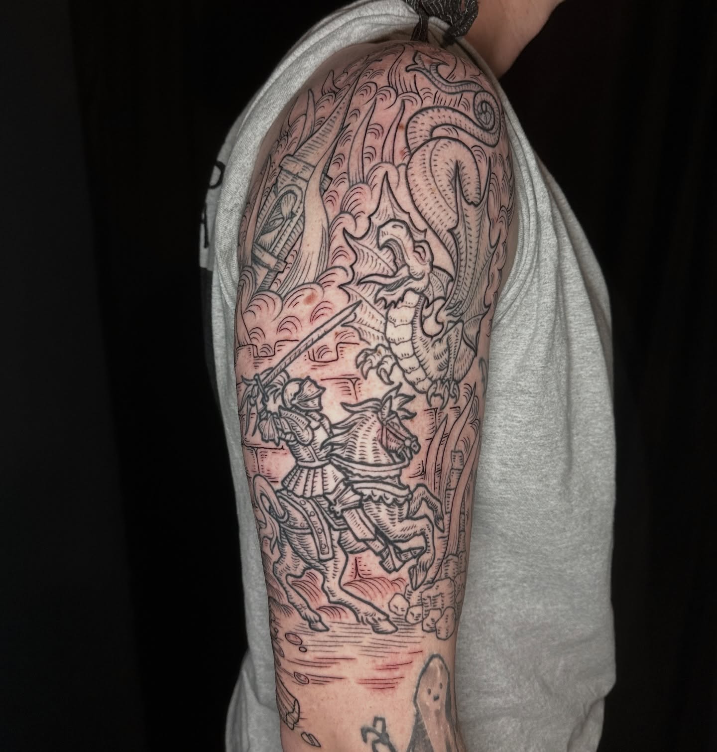 St George slaying dragon American traditional tattoo on the forearm by Joel Smith, Manhattan, Kansas