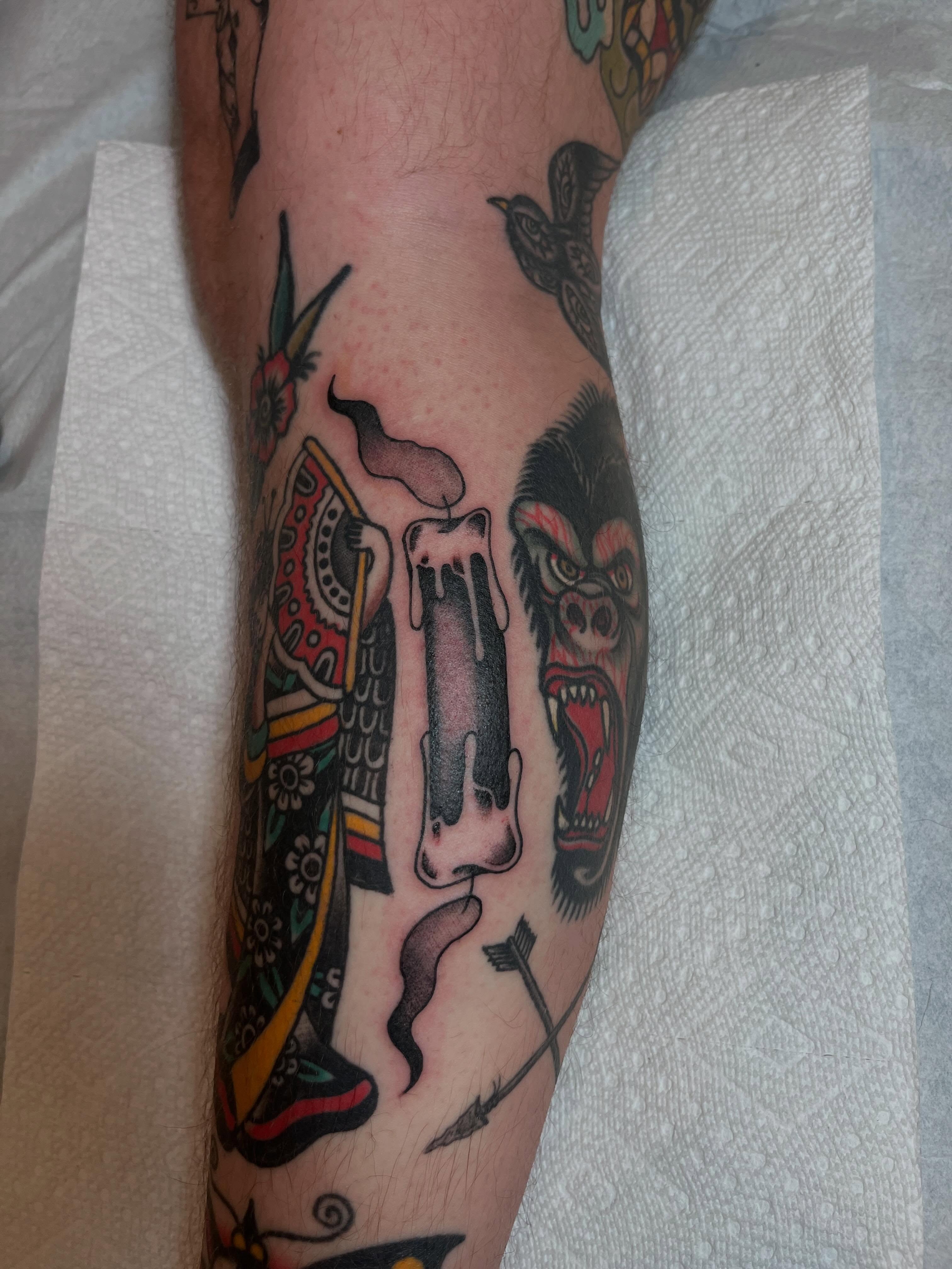 Gorilla and candle American traditional tattoo on the forearm by Jackson Kirchhoff