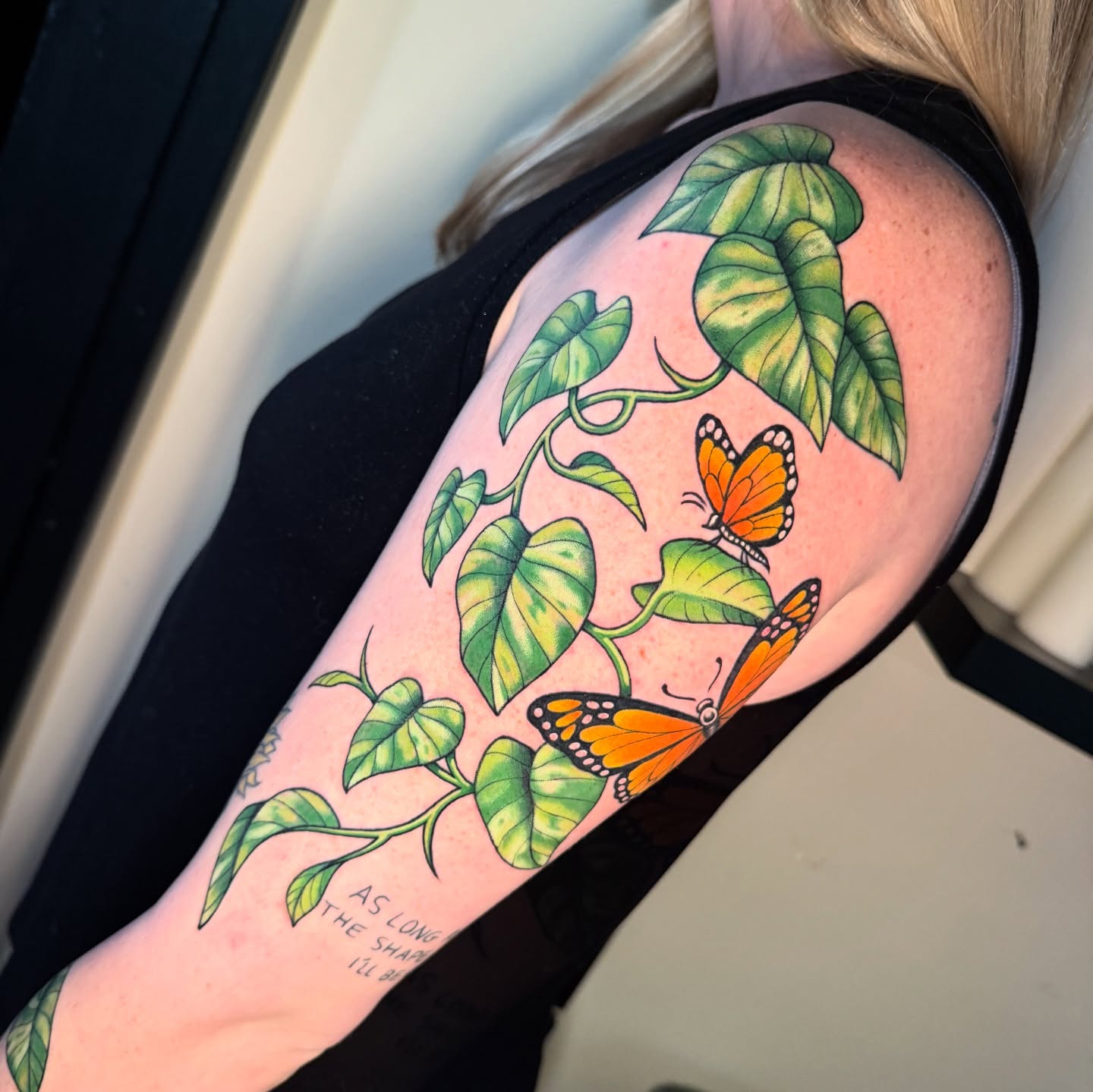Monstera leaves and butterflies realism tattoo on the shoulder by Chelstine, Encinitas, California