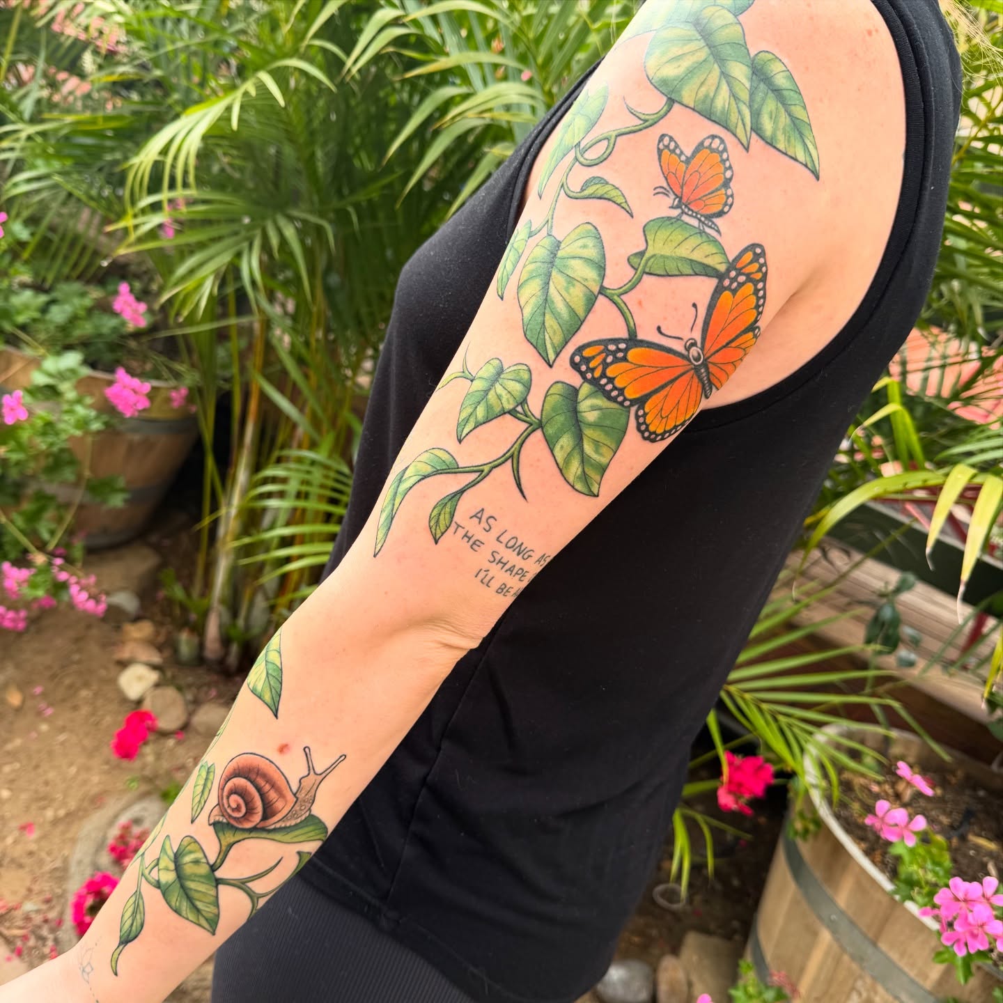 Monarch butterflies and snail new school tattoo on the forearm by Chelstine, Encinitas, California