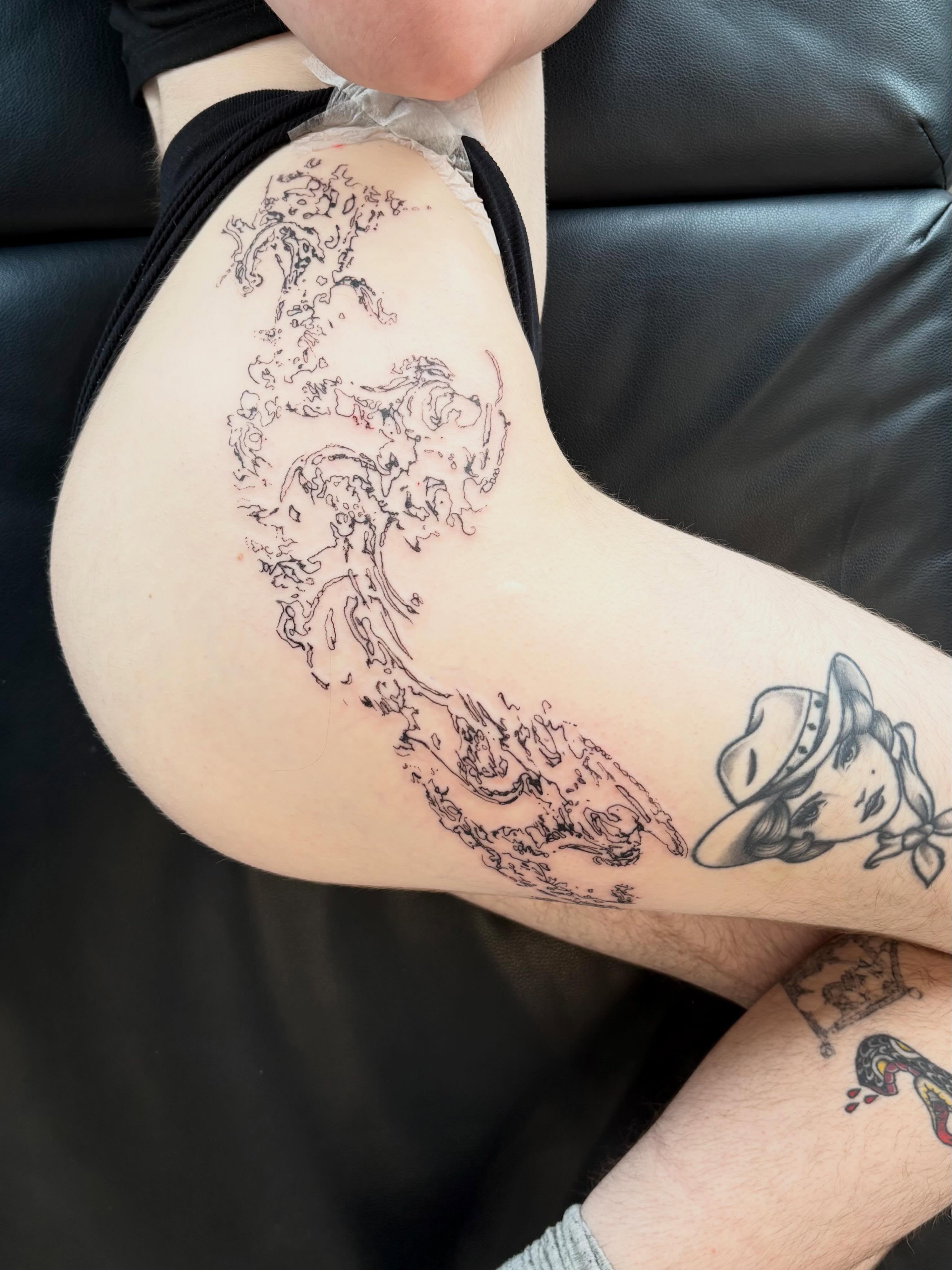 Abstract figure black and grey tattoo on the thigh by madeline